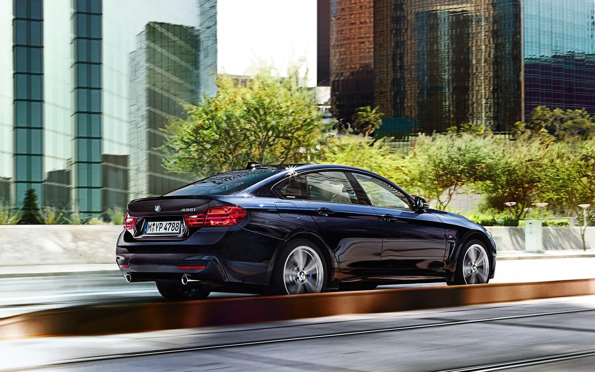 Bmw Sedan Driving Through Modern City with Motion Blur