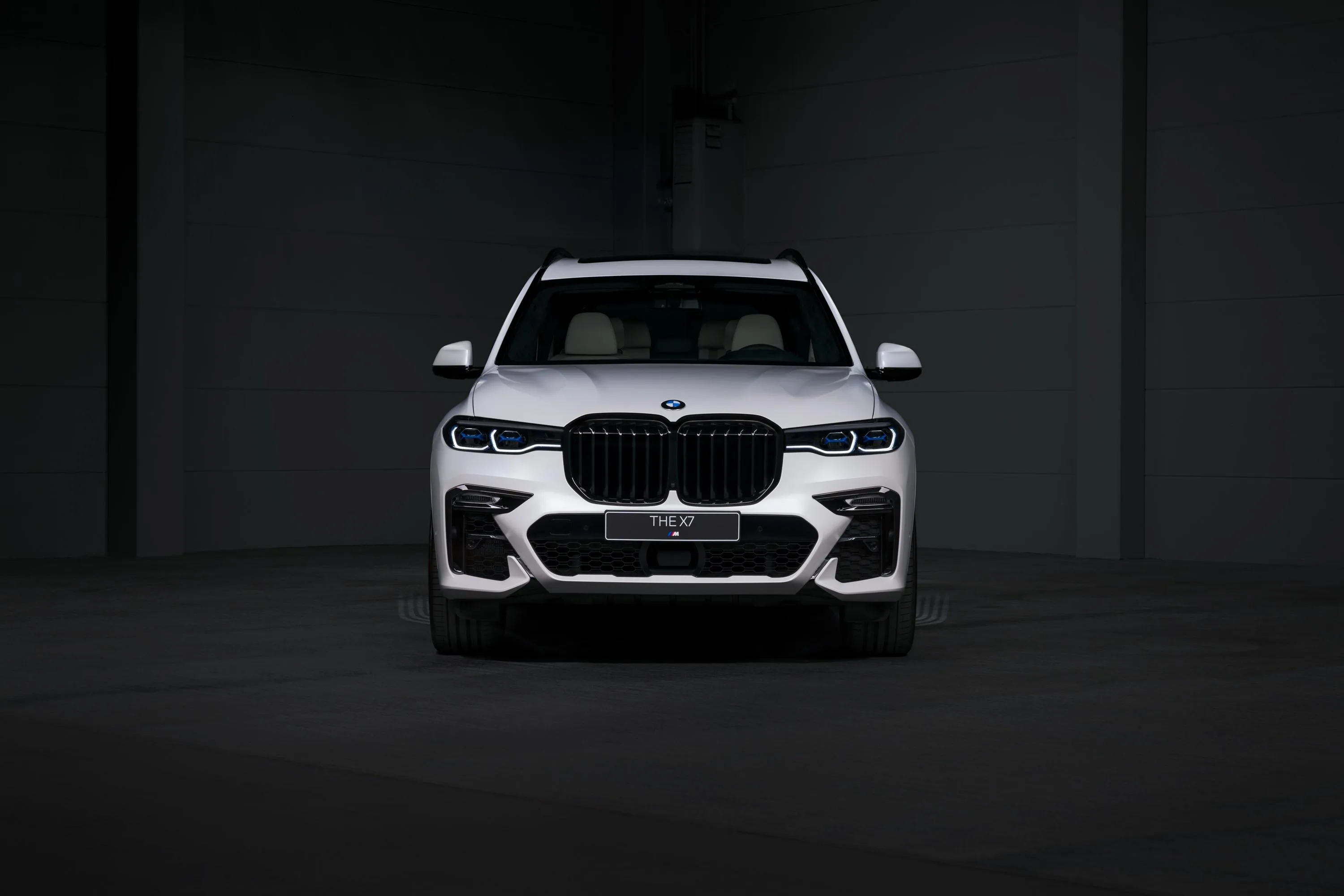 Bmw Sedan Front View in a Dark Setting with Glowing Lights