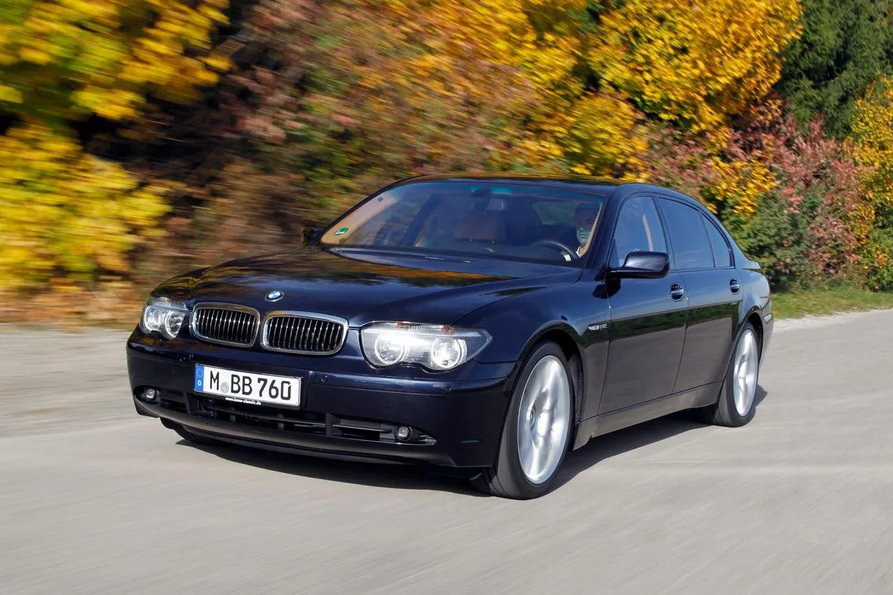 Bmw Sedan in a Scenic Road with Fall Foliage in the Background
