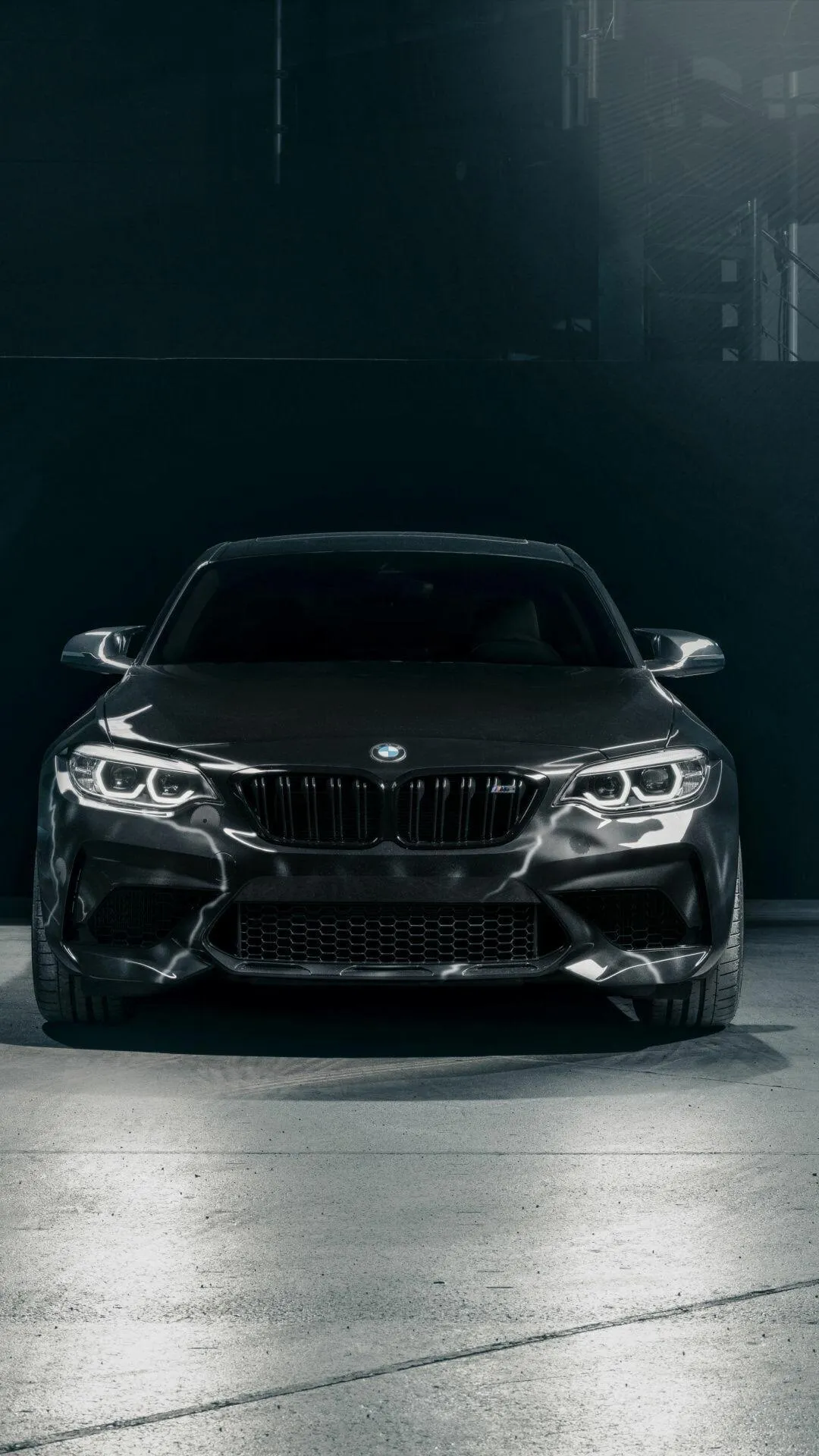 Bmw Sedan in Dim Light Exuding Elegance and Power Wallpaper