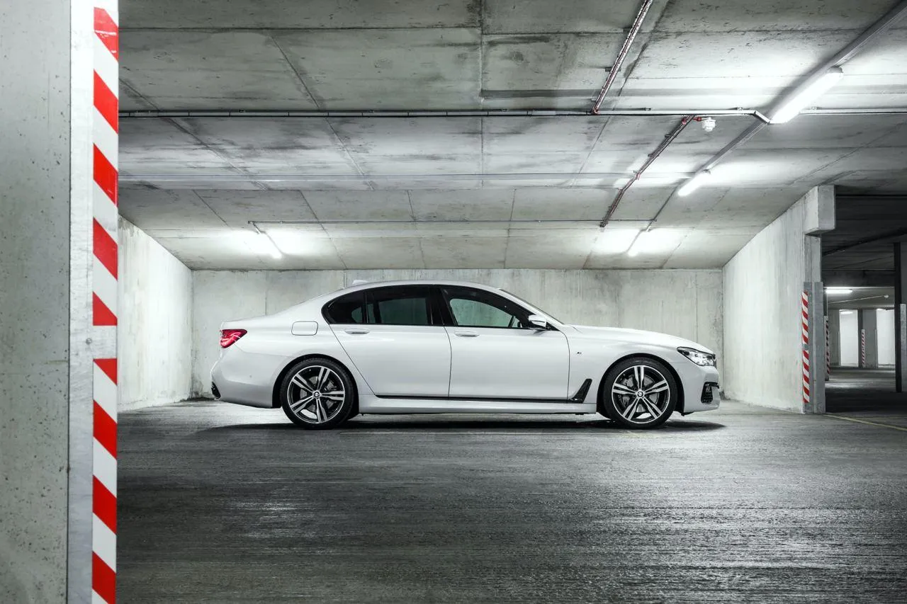 Bmw Sedan in Parking Garage with Smooth Concrete Texture