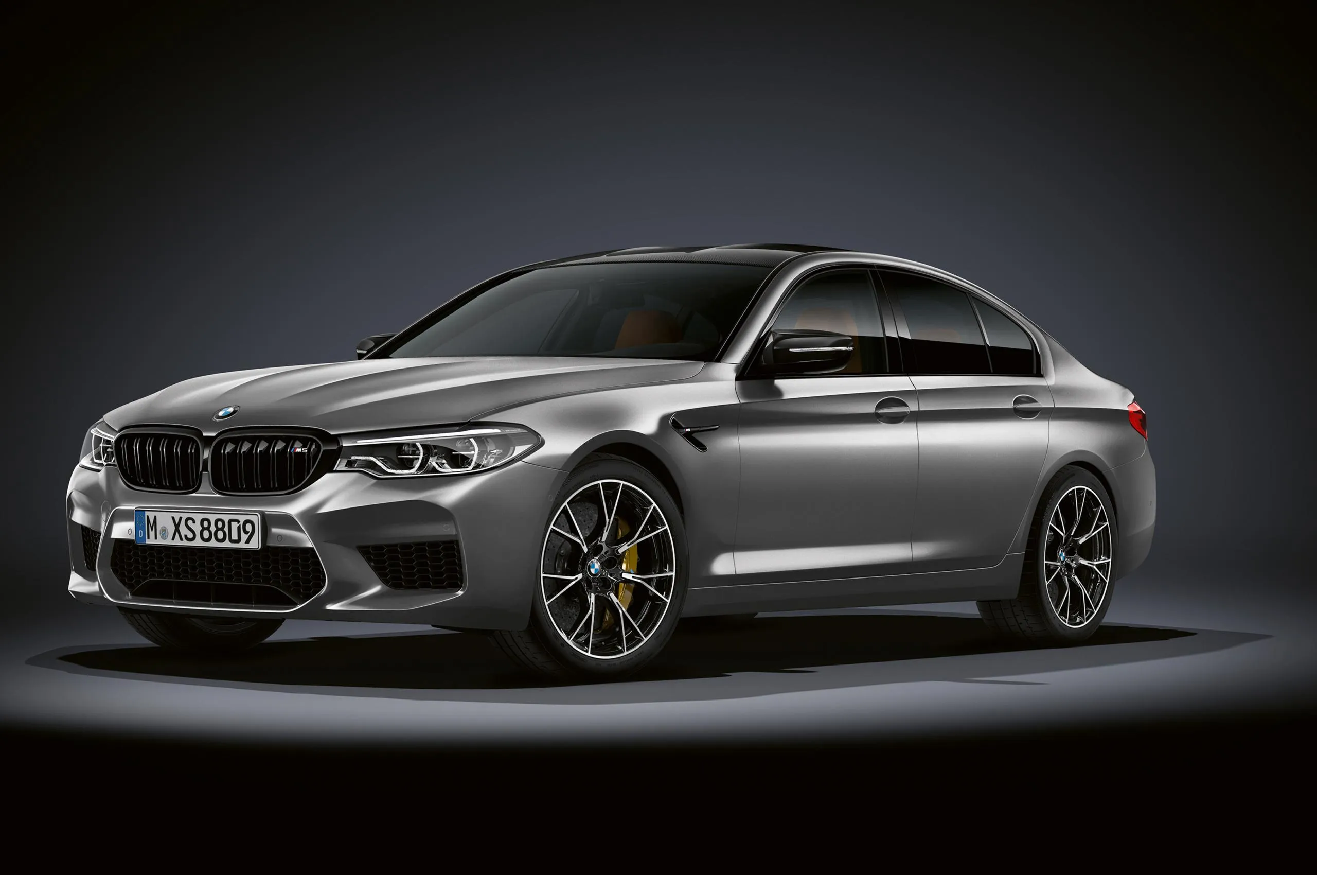 Bmw Sedan on a Sharp Turn in an Open Landscape Wallpaper