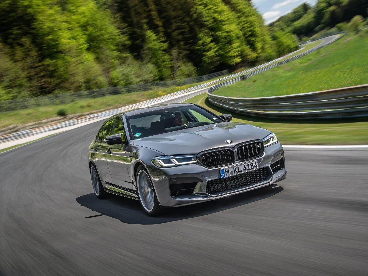 Bmw Sedan Parked on Mountain Road with Green Nature