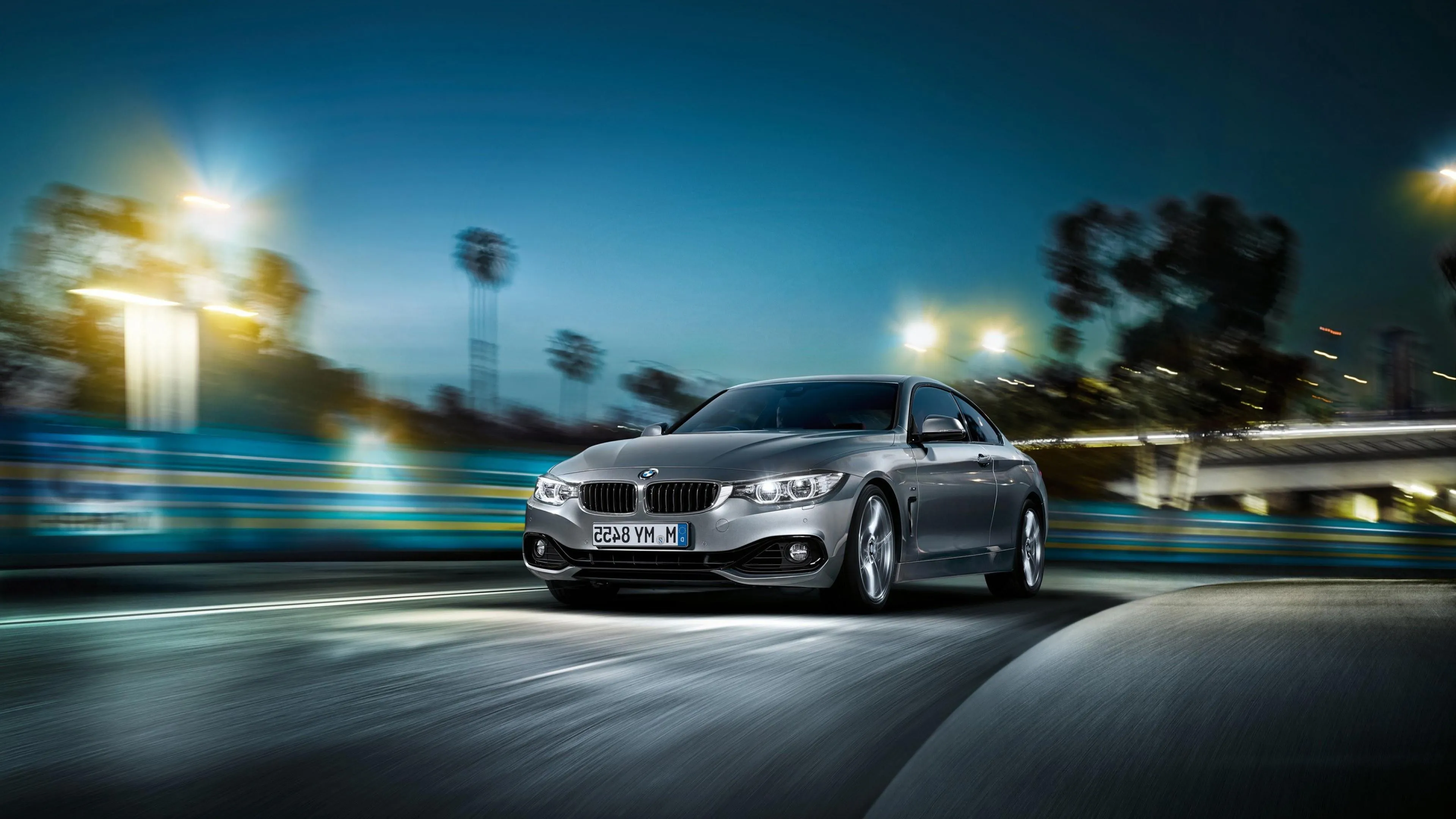 Bmw Speeding Through City at Night with Motion Lights