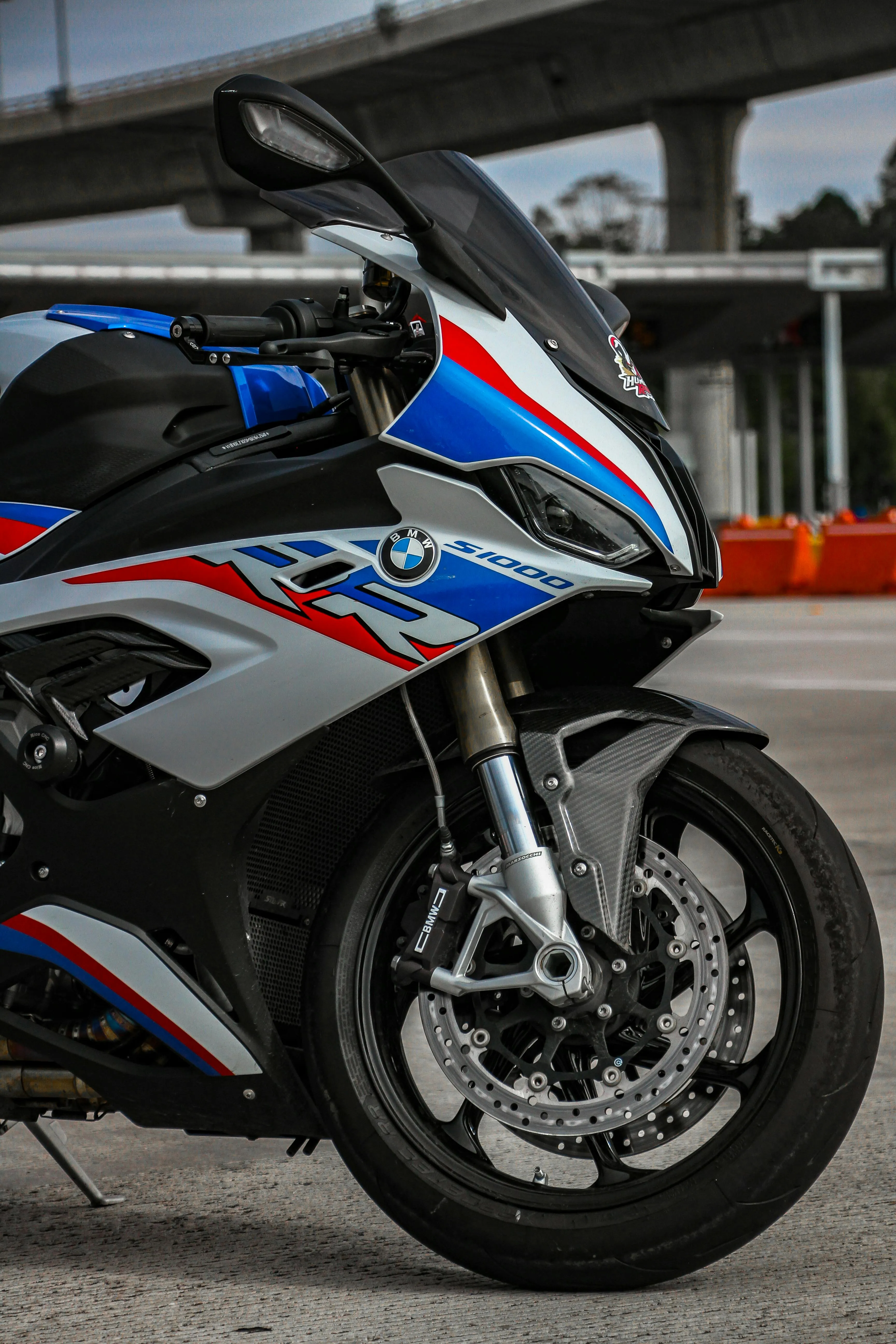 Bmw Sport Motorcycle Parked Near Track with Helmet On