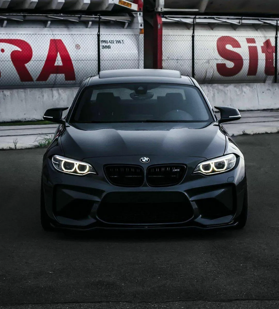 Bmw Sports Car at Race Track with Crowd in Background
