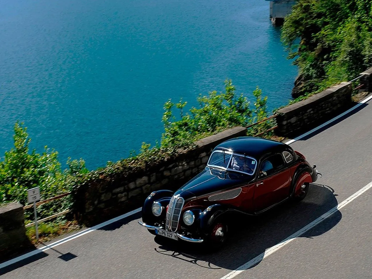 Bmw Sports Car Cruising Along a Scenic Coastal Road