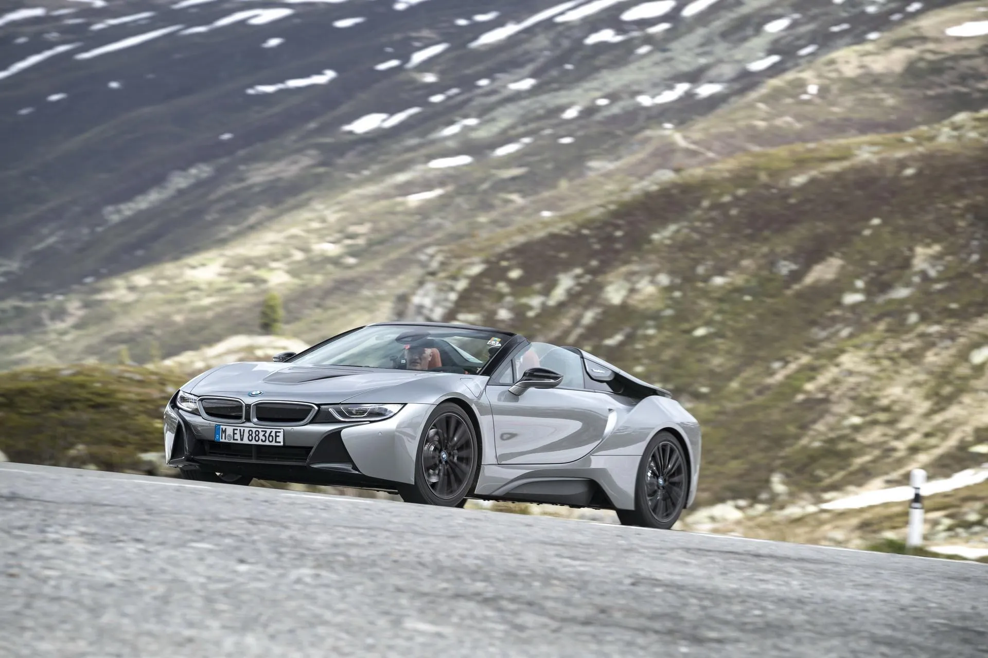 Bmw Sports Car Cruising Through Scenic Mountain Road