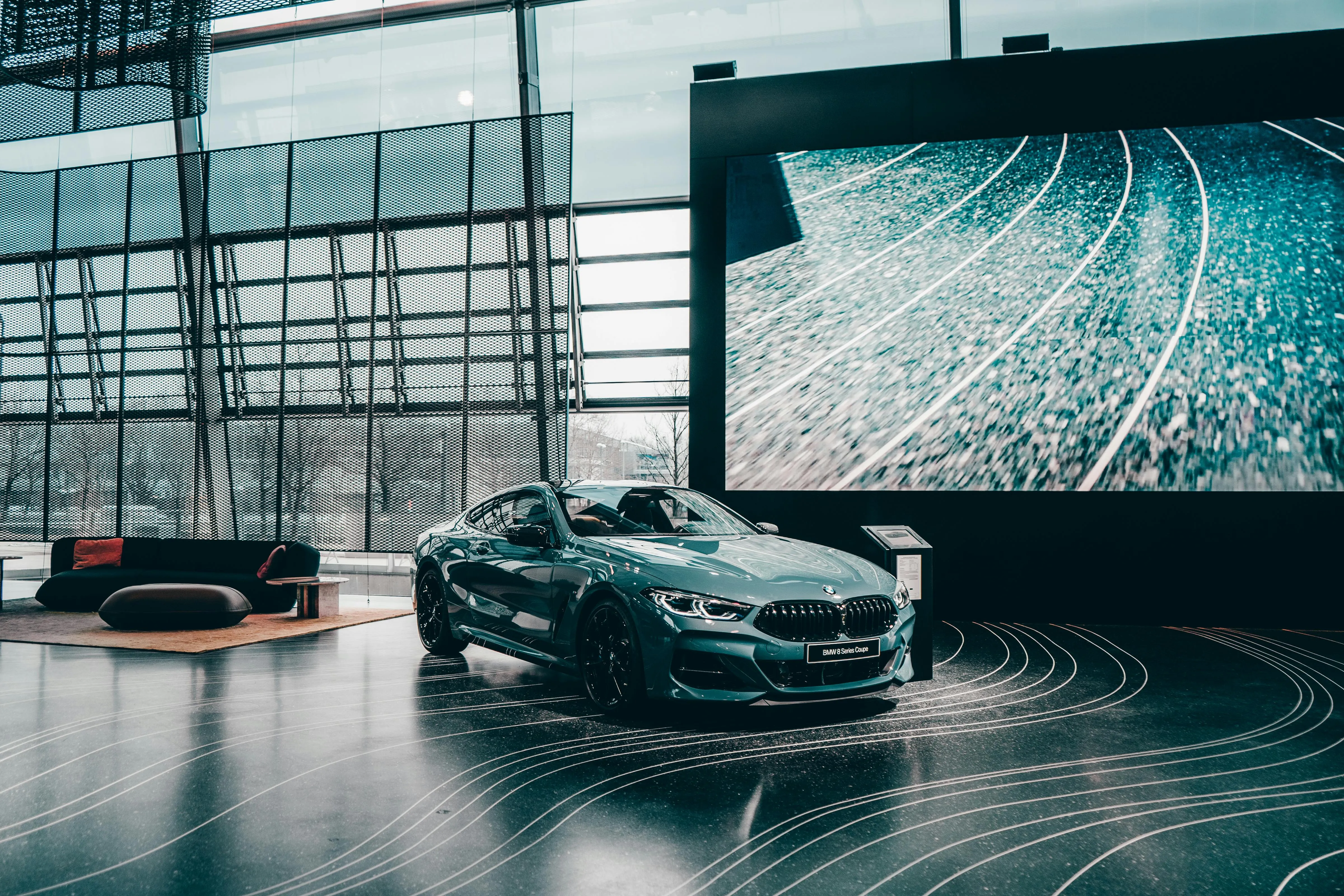 Bmw Sports Car Displayed Indoors in a Showroom Wallpaper