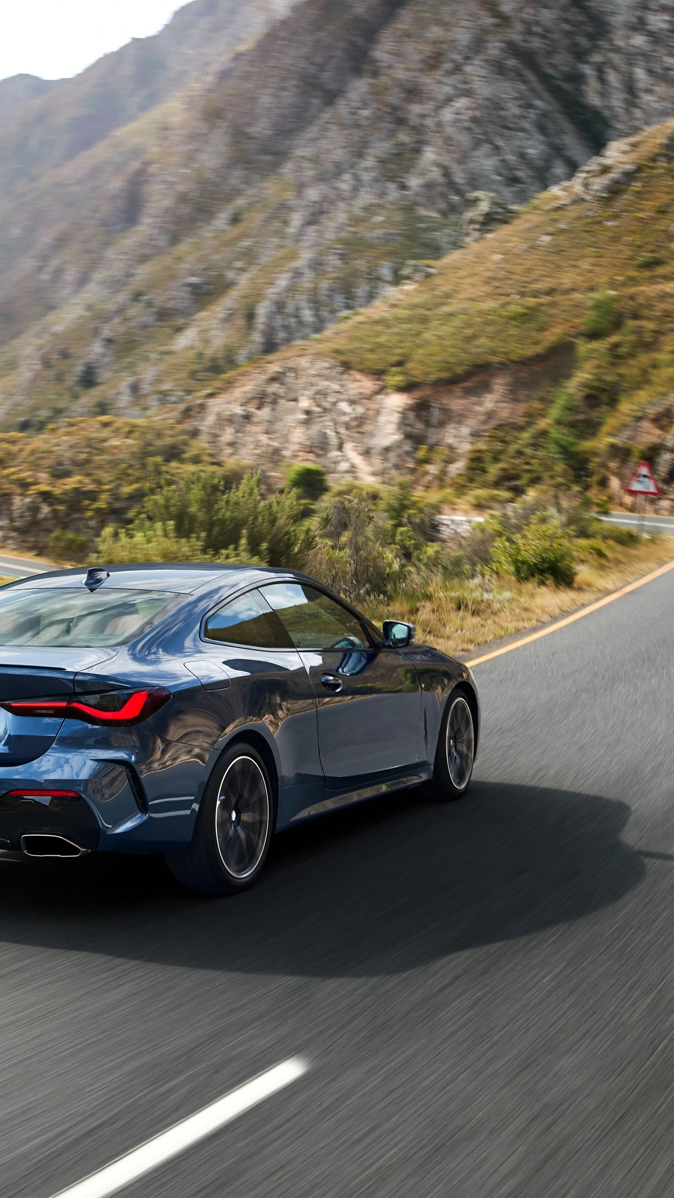 Bmw Sports Car Driving Fast on Mountain Road Curve