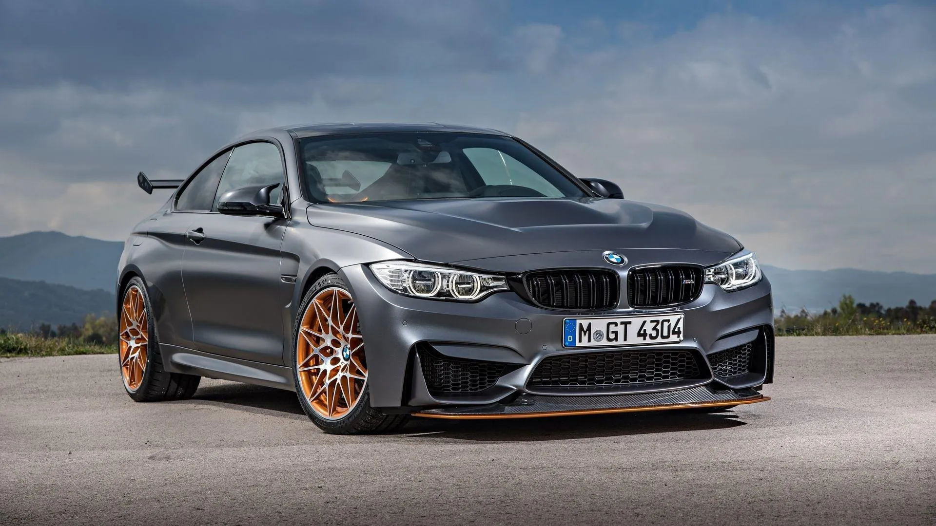 Bmw Sports Car Parked on Open Road with Aggressive Stance