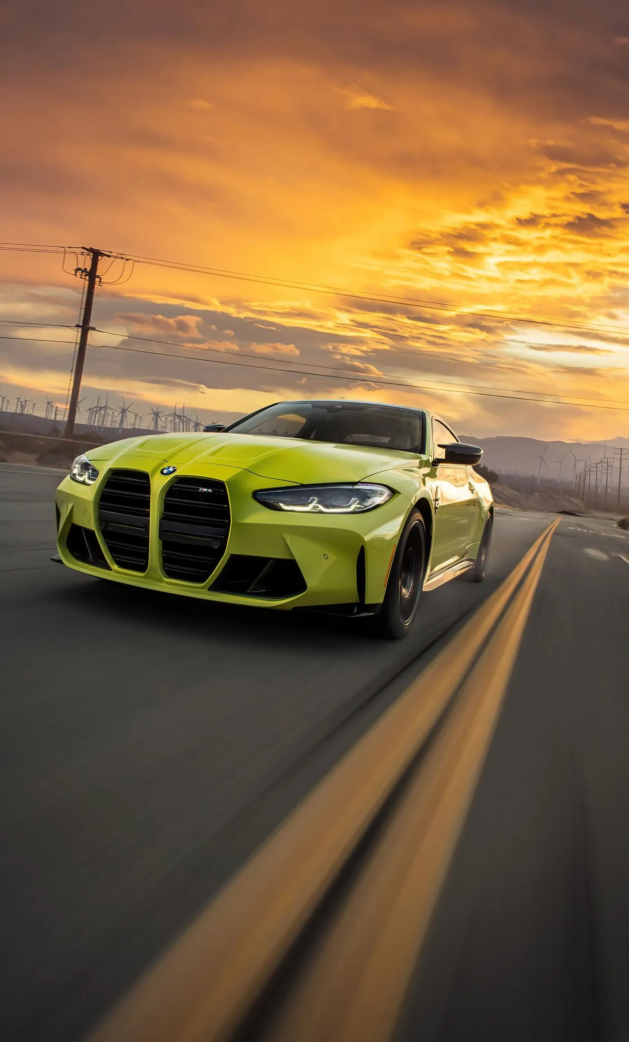 Bmw Sports Car Speeding on Open Road at Sunset Image