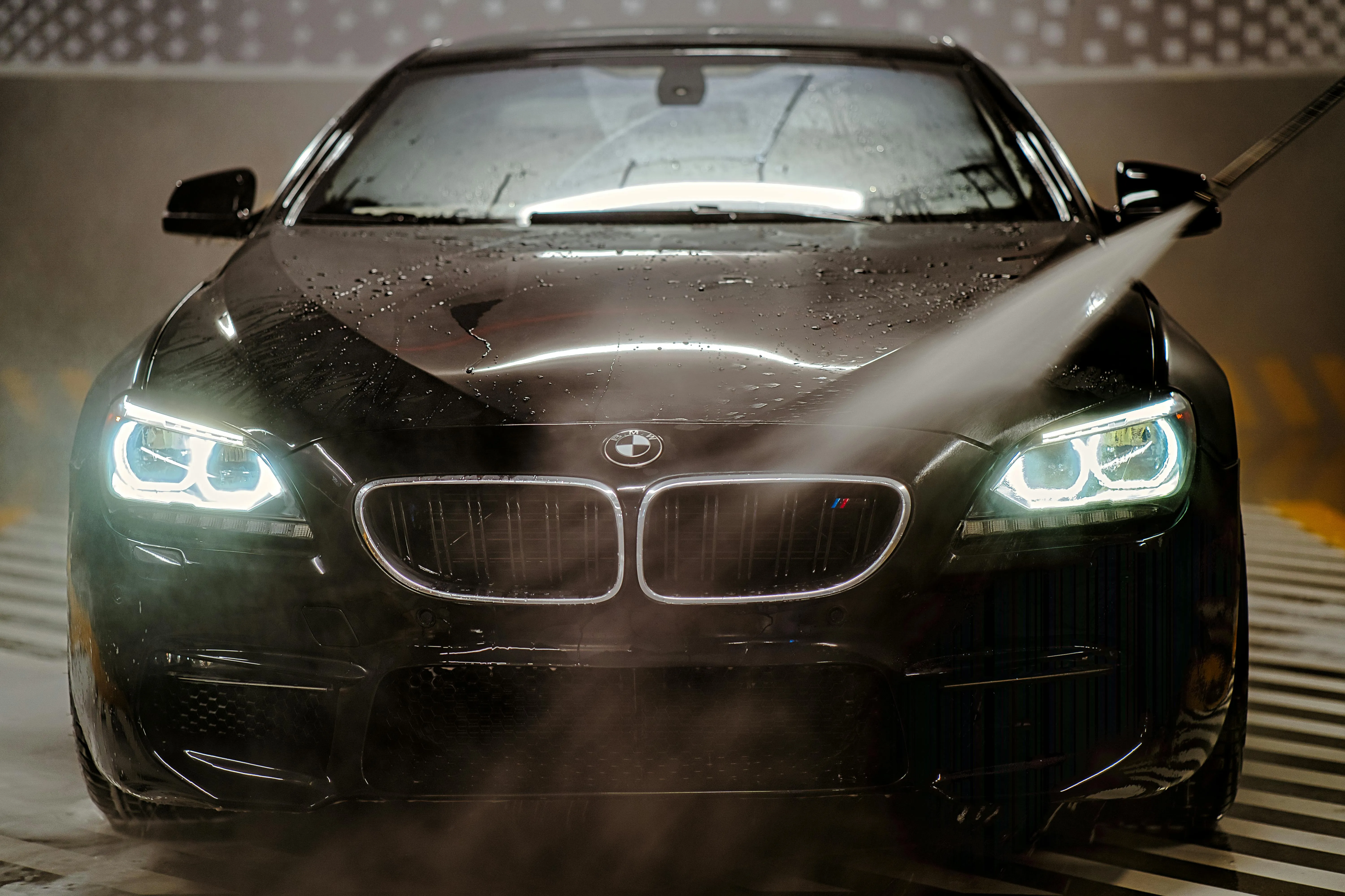 Bmw Sports Car with Headlights on in a Foggy Setting