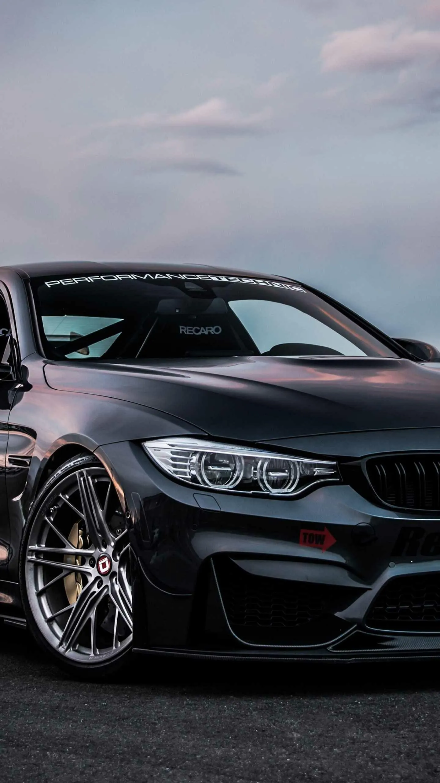 Bmw Sporty Black Sedan with Custom Wheels on a Clear Road