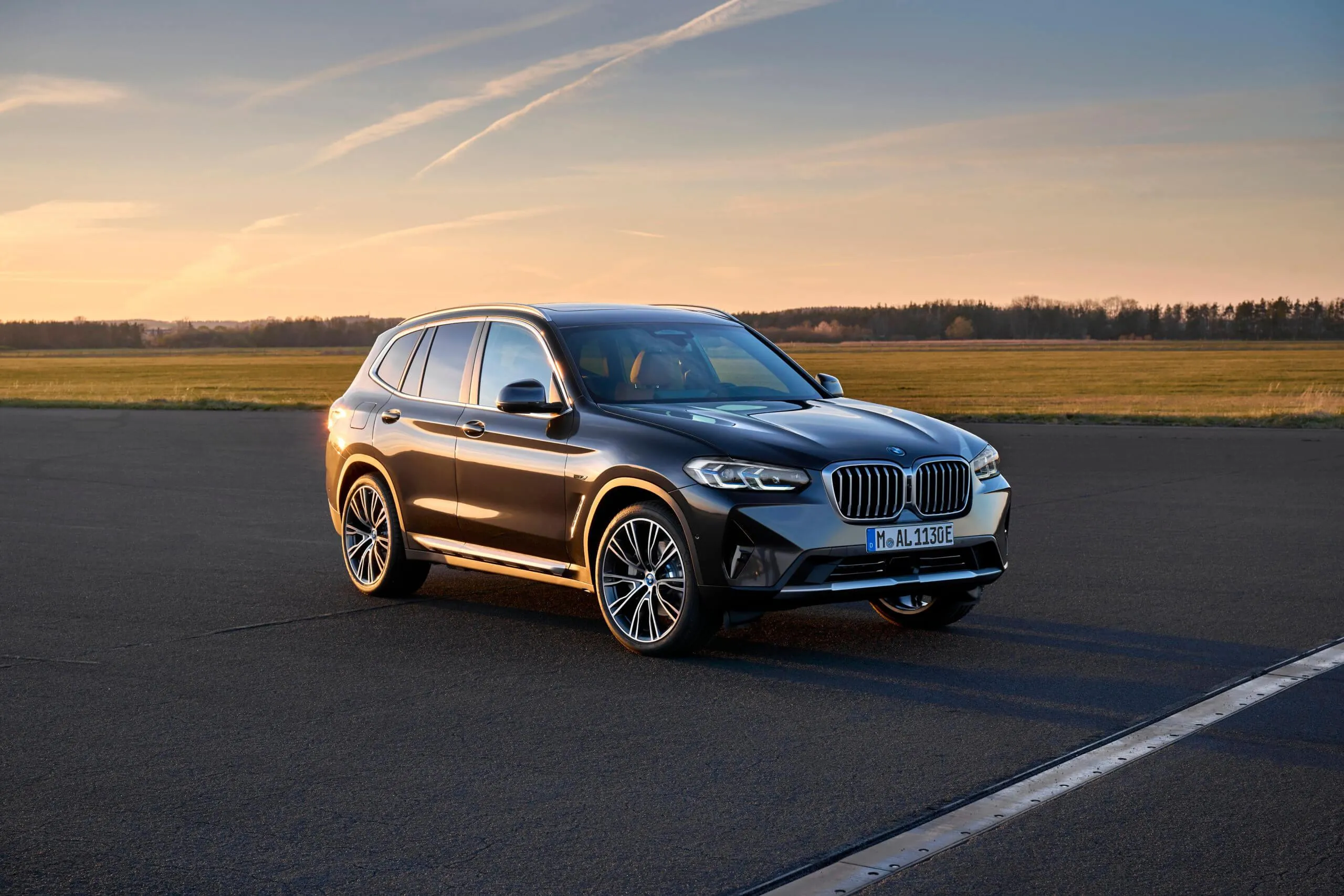 Bmw Suv Driving Alone on Empty Road at Golden Hour Hd