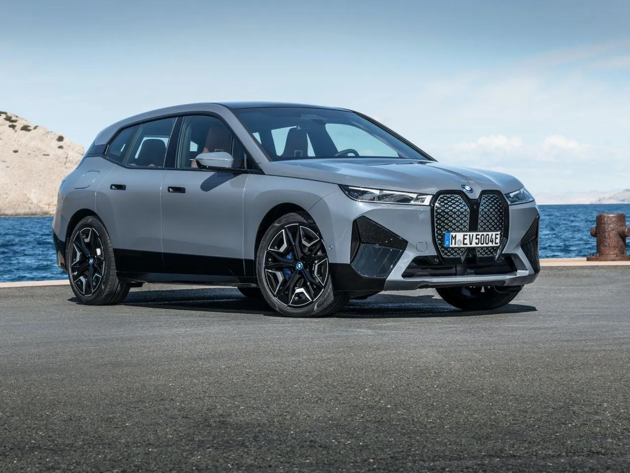 Bmw Suv Driving Along the Coastal Road with Ocean Views