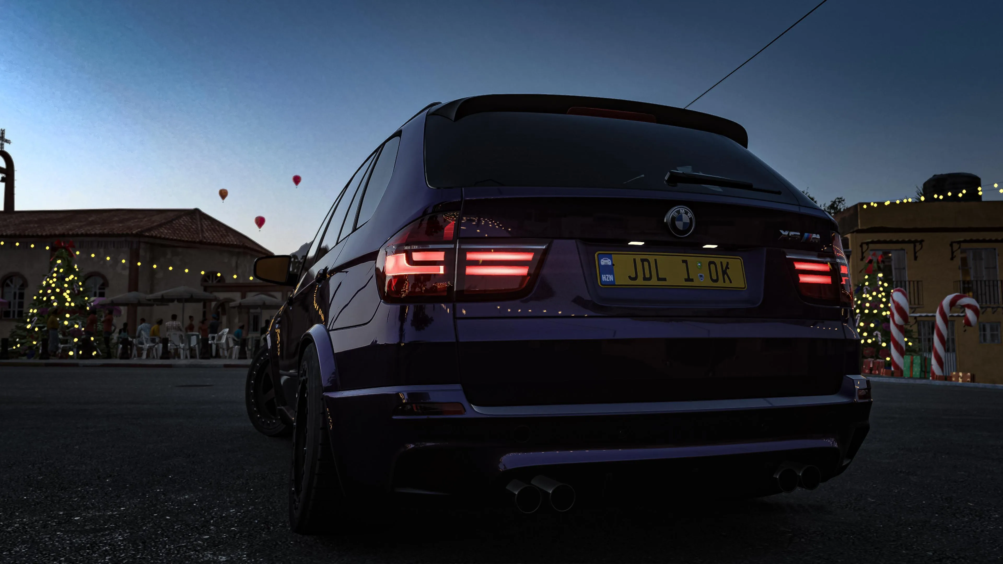 Bmw Suv Driving at Night with Taillights Glowing Wallpaper