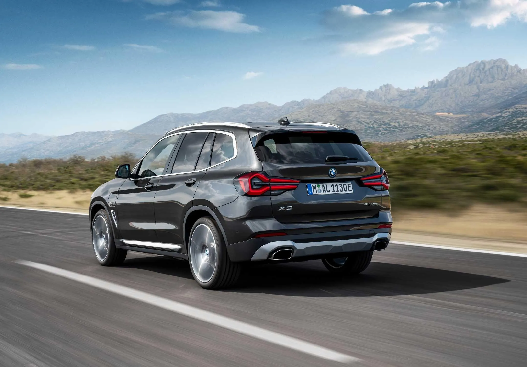 Bmw Suv Driving on a Country Road with Blue Sky View