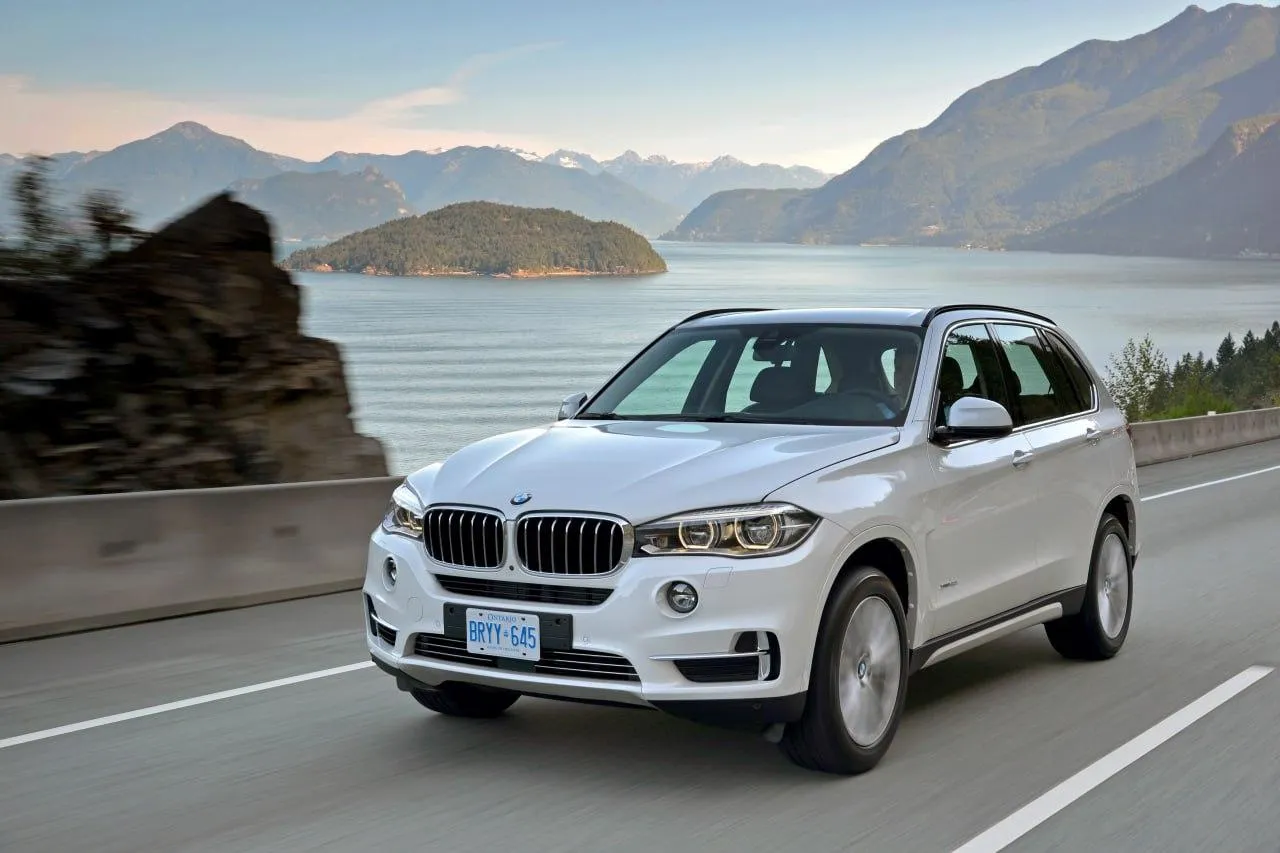 Bmw Suv Driving on a Mountain Road with Scenic View