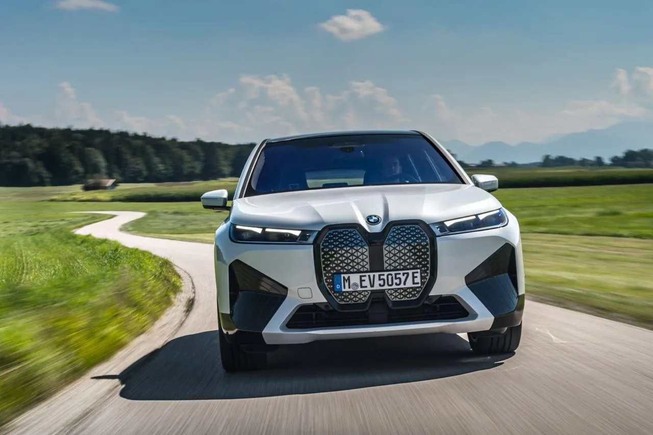 Bmw Suv Driving on Country Road with Green Fields Around
