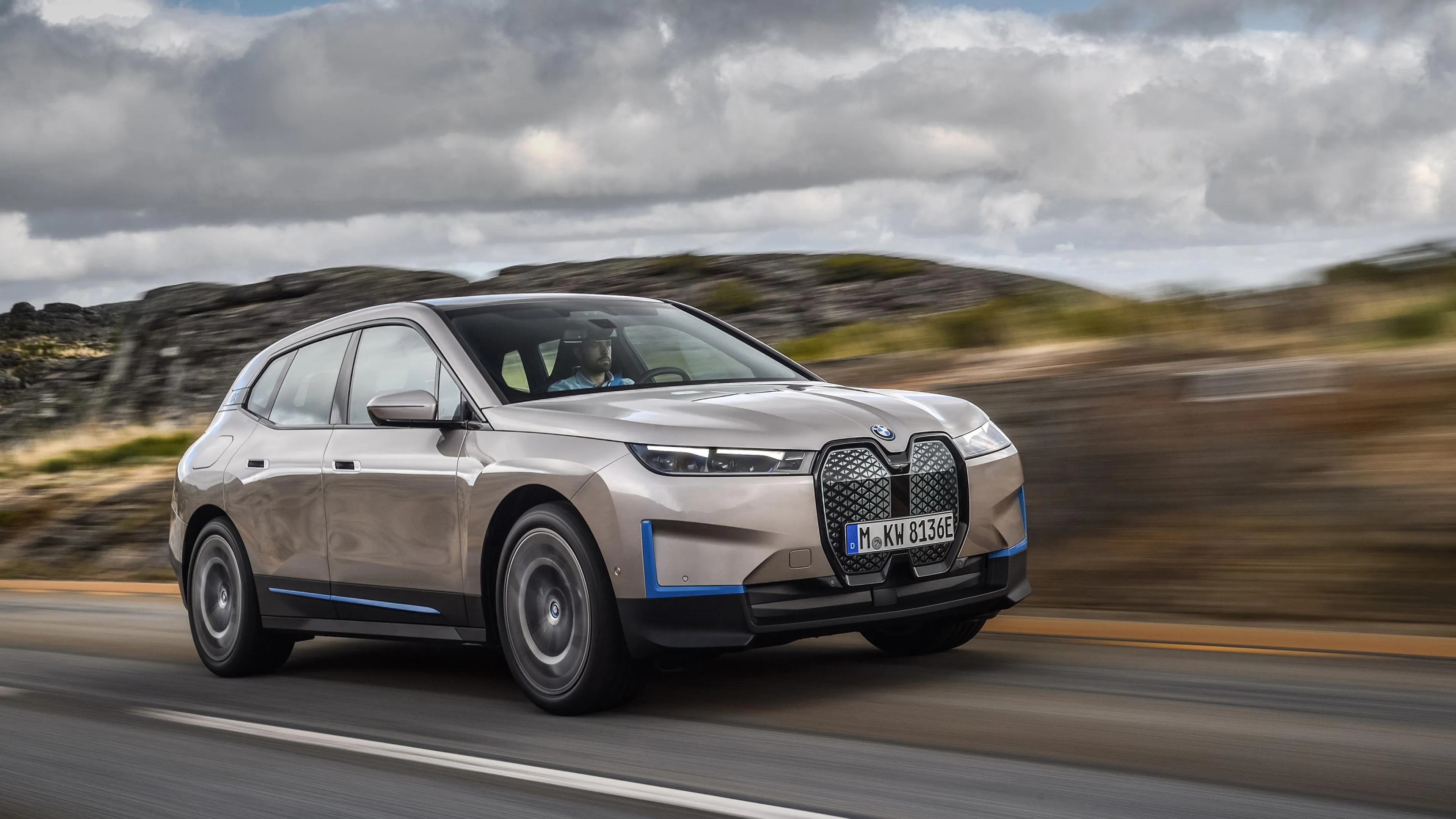 Bmw Suv Driving on Curved Road in Mountain Area Image