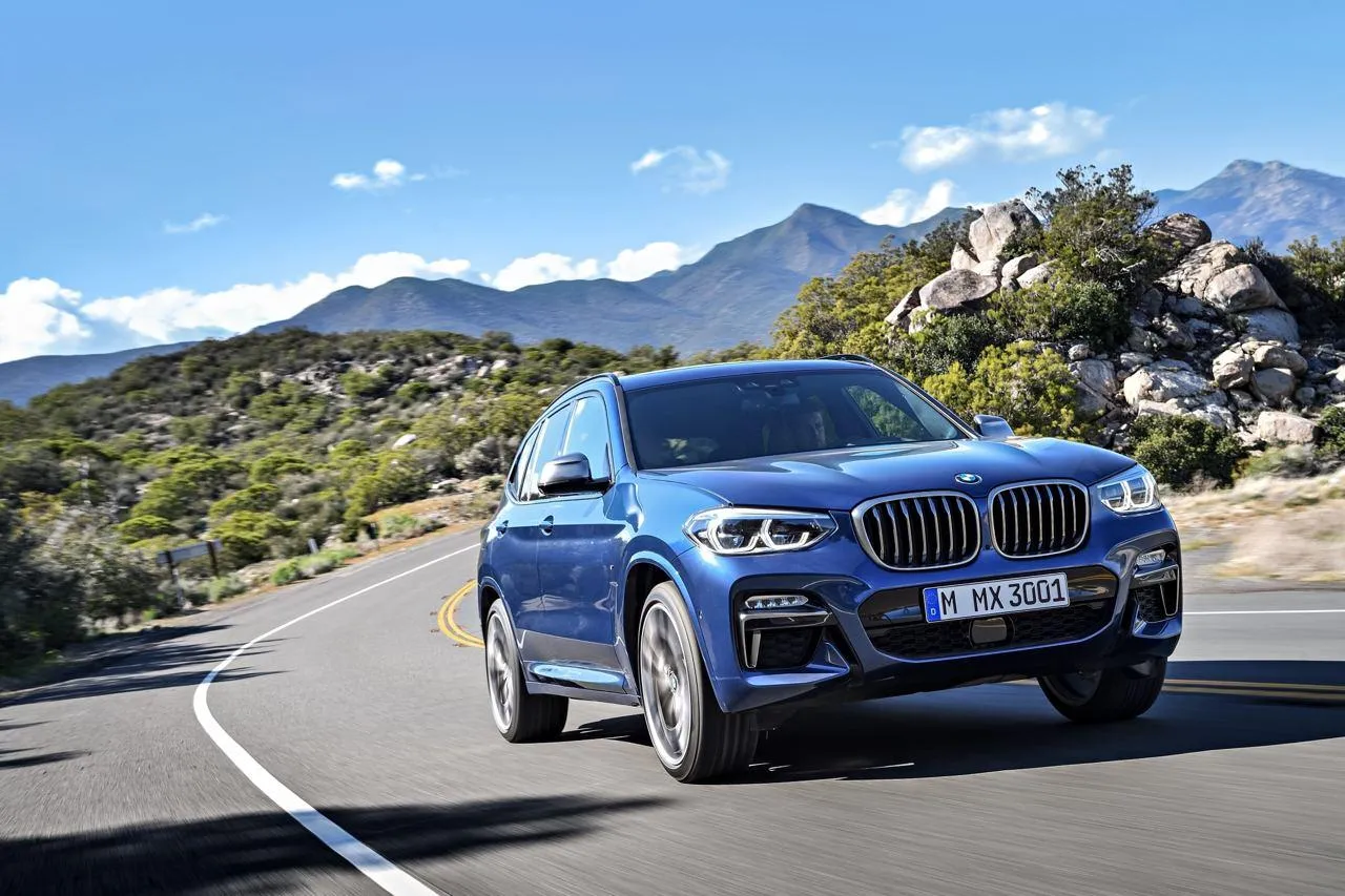 Bmw Suv Driving on Winding Road with Mountain Views