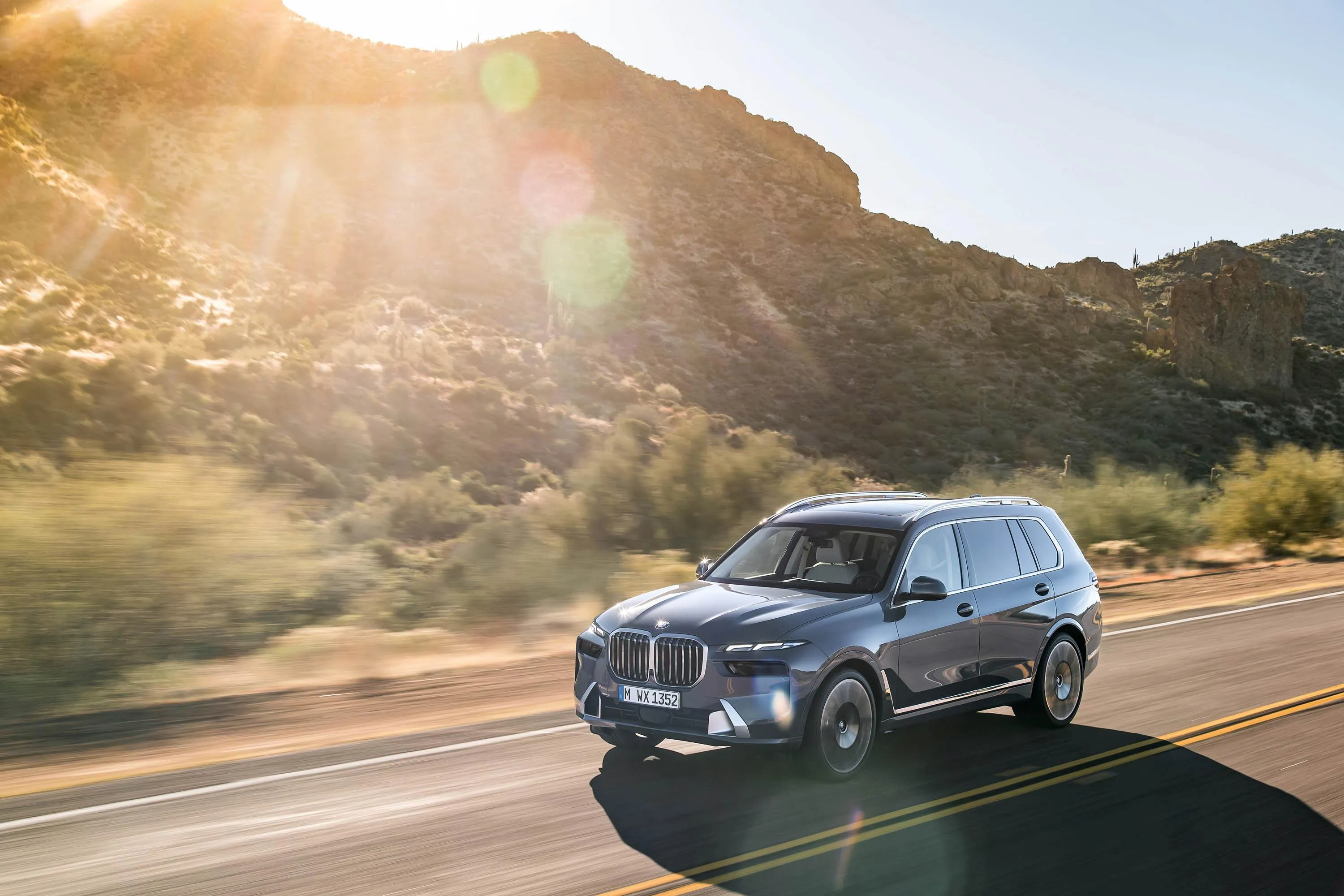 Bmw Suv Driving Through Sunny Desert Mountain Road 4K