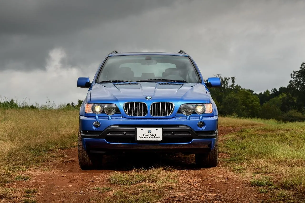Bmw Suv Off Roading Through Rugged Terrain Landscape