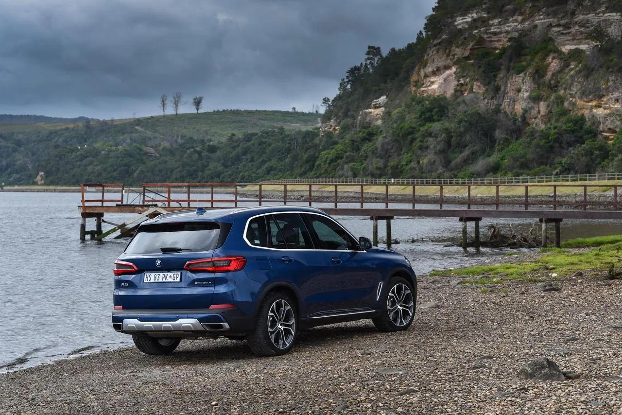 Bmw Suv on the Coast with a View of the Ocean Wallpaper