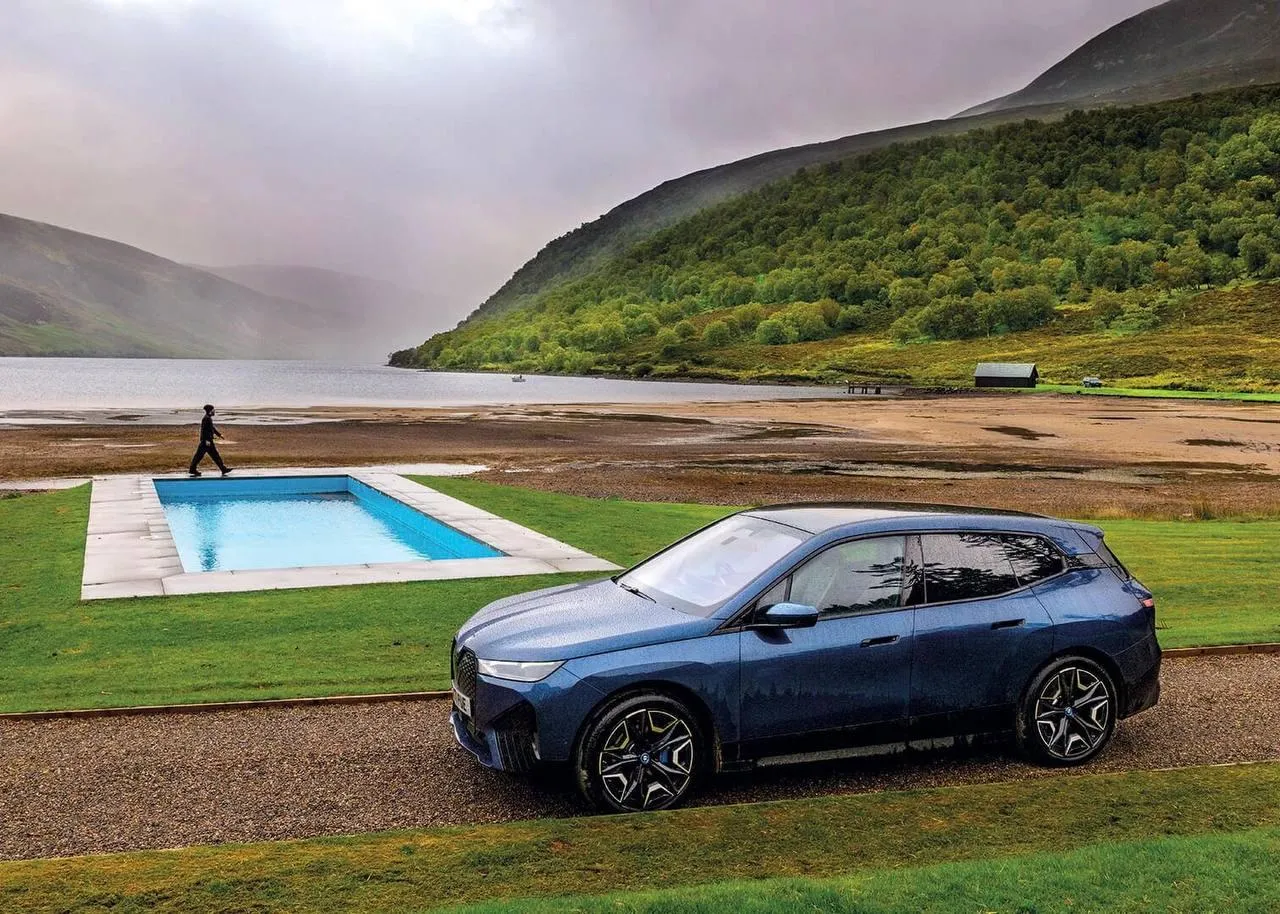 Bmw Suv Parked By a Scenic View of a Remote Mountain Pool