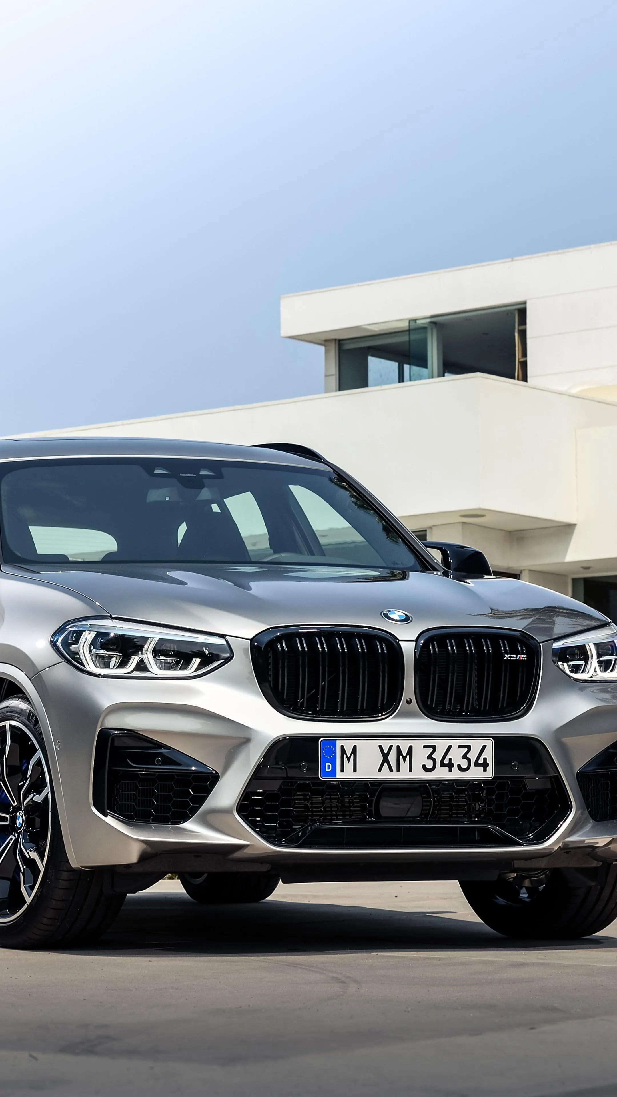 Bmw Suv Parked in Front of White Luxury Modern Villa