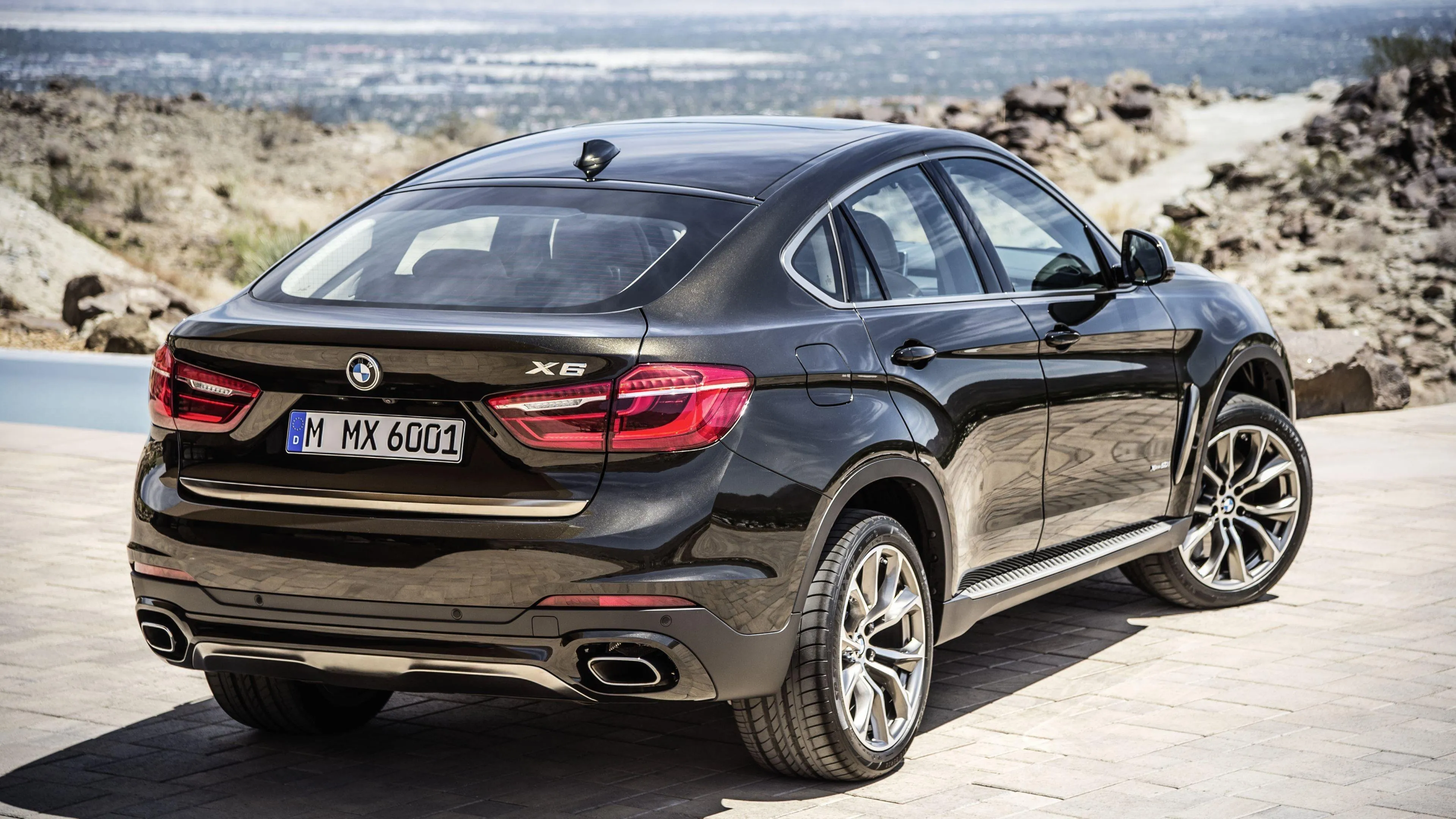 Bmw Suv Parked on Sandy Path with Clear Blue Sky Above
