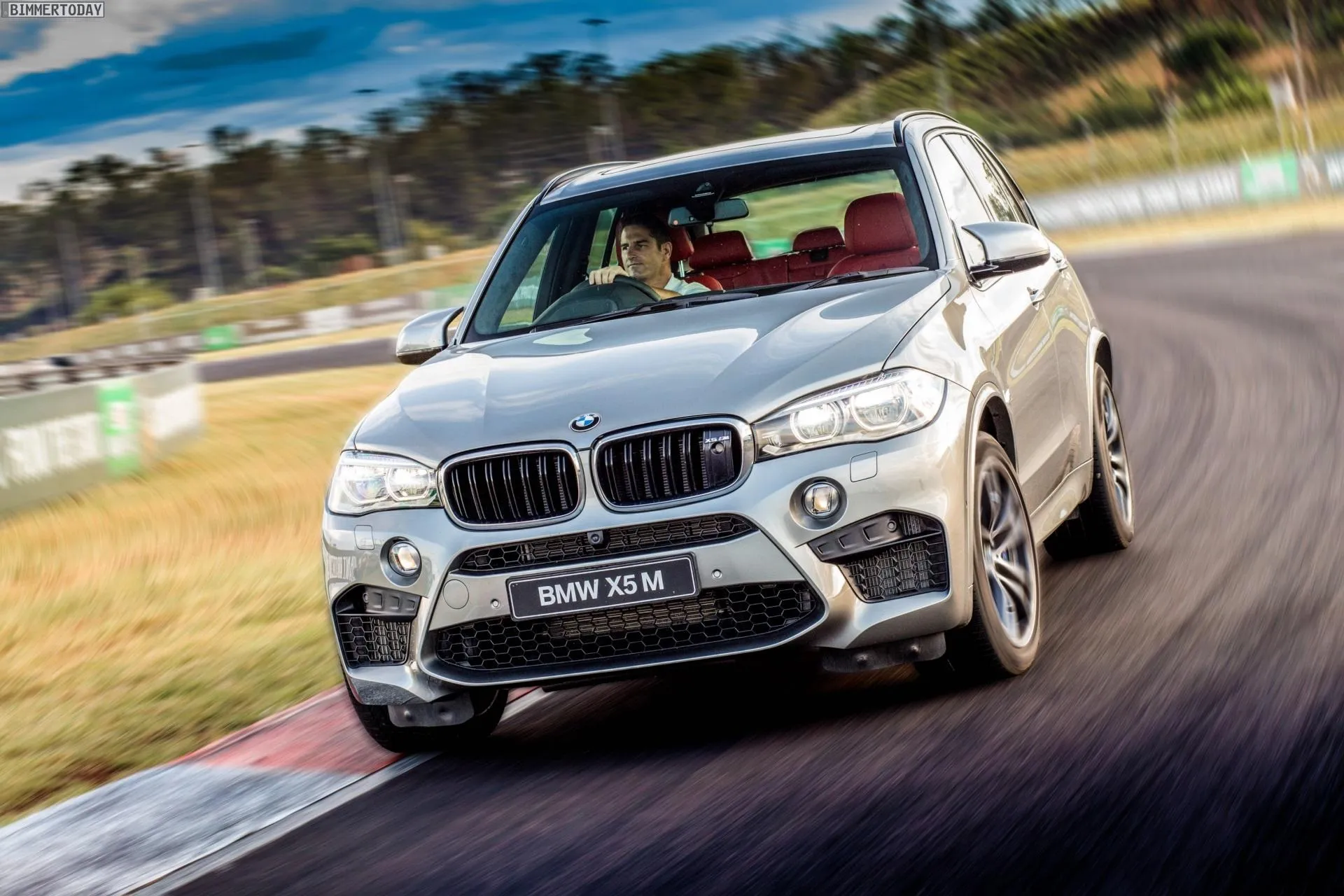 Bmw Suv Taking a Sharp Turn on a Professional Race Track