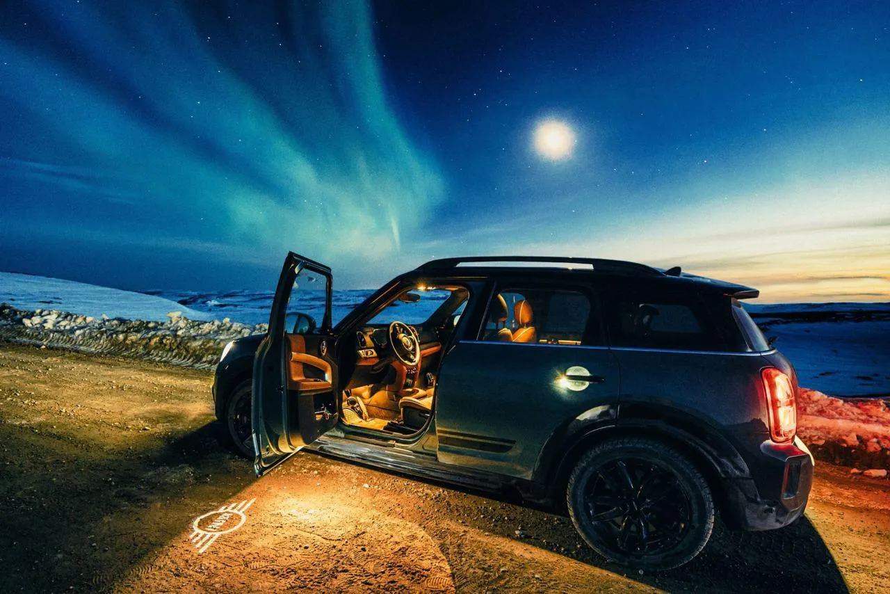 Bmw Suv Under a Glowing Blue Sky in an Open Outdoor Area