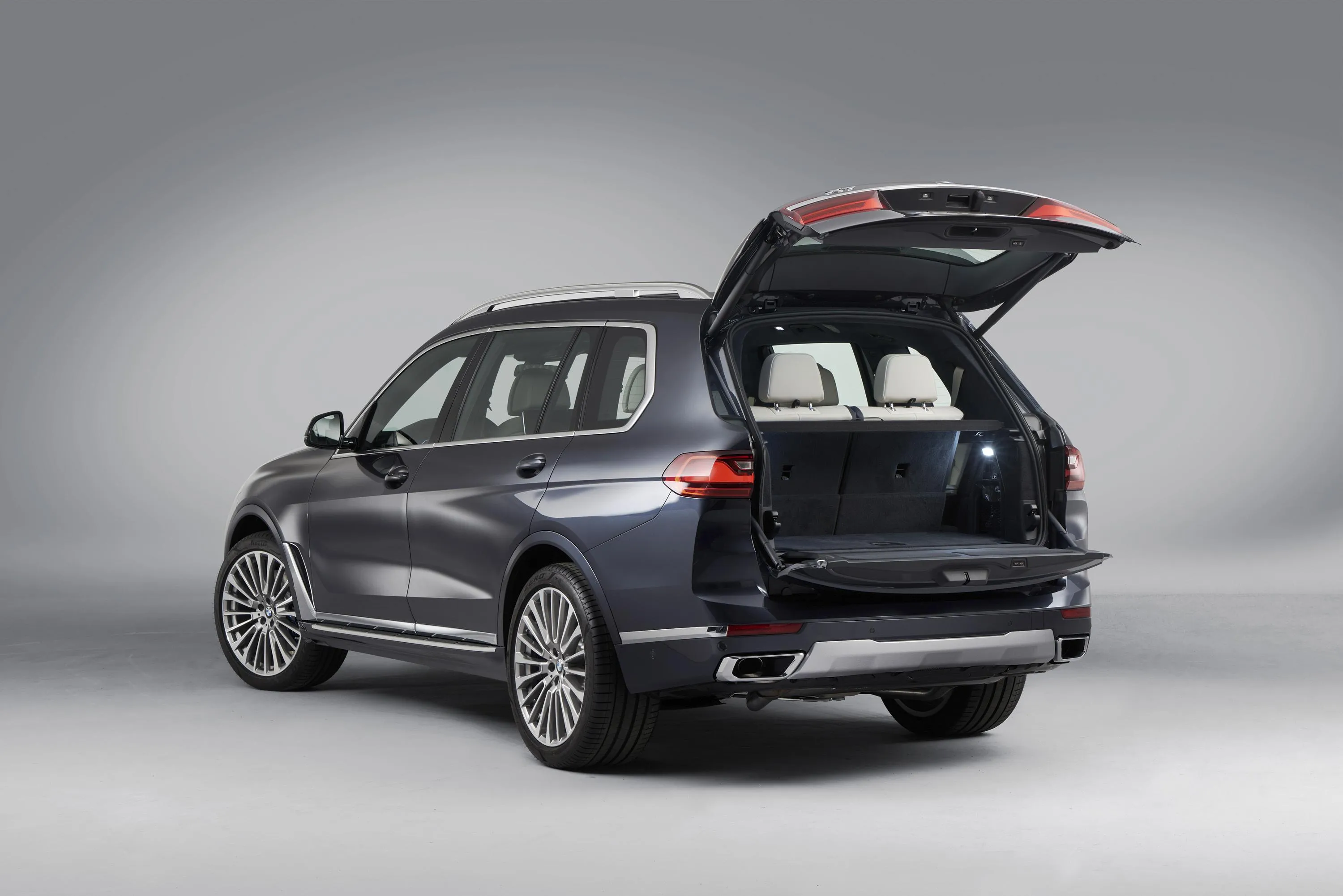 Bmw Suv with Open Trunk in Studio Setting Hd Wallpaper