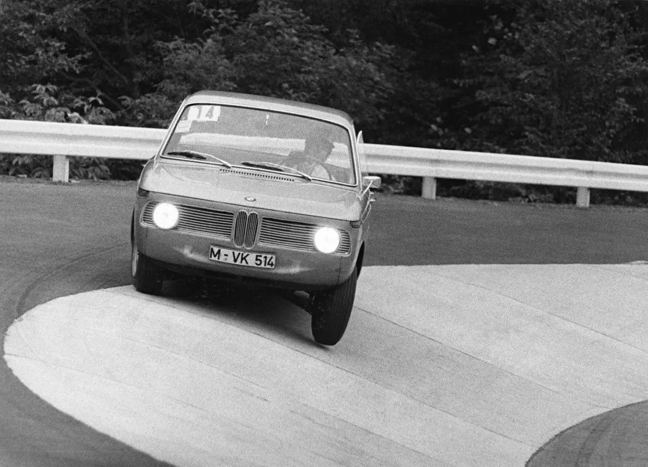 Bmw Taking Sharp Turn on Curved Track Wallpaper Hd