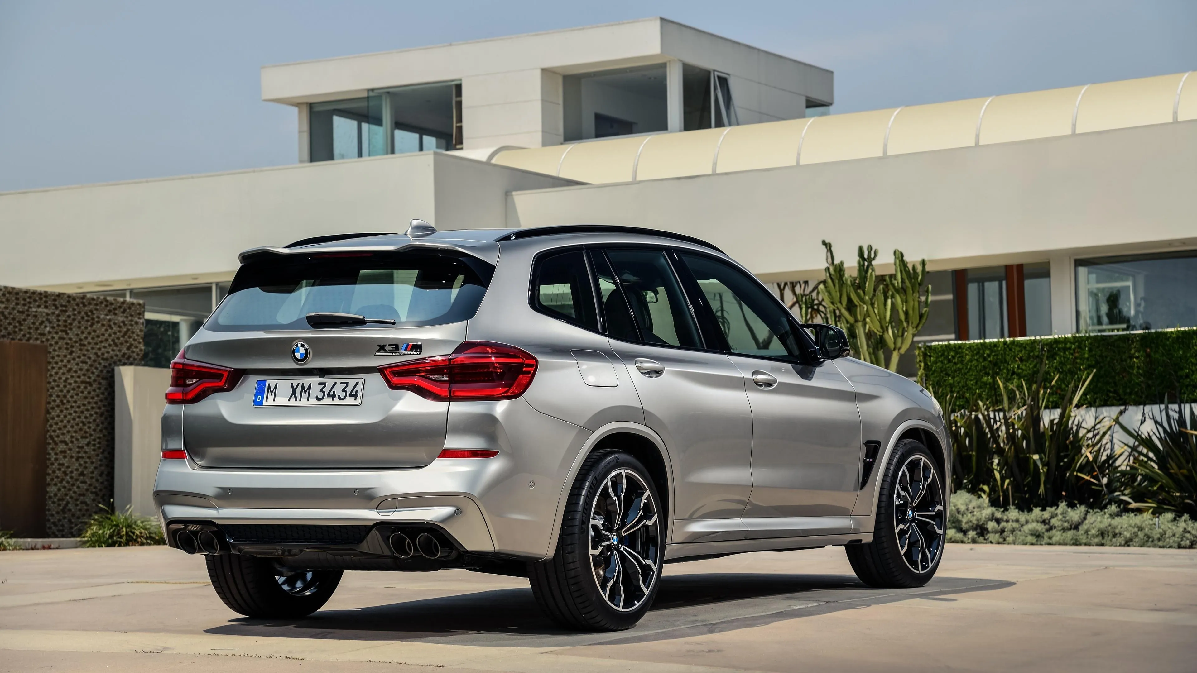 Bmw Touring Car Parked in Front of Modern House Wallpaper
