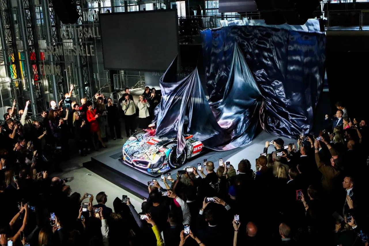 Bmw Unveiling Event with Dramatic Lighting and Excitement