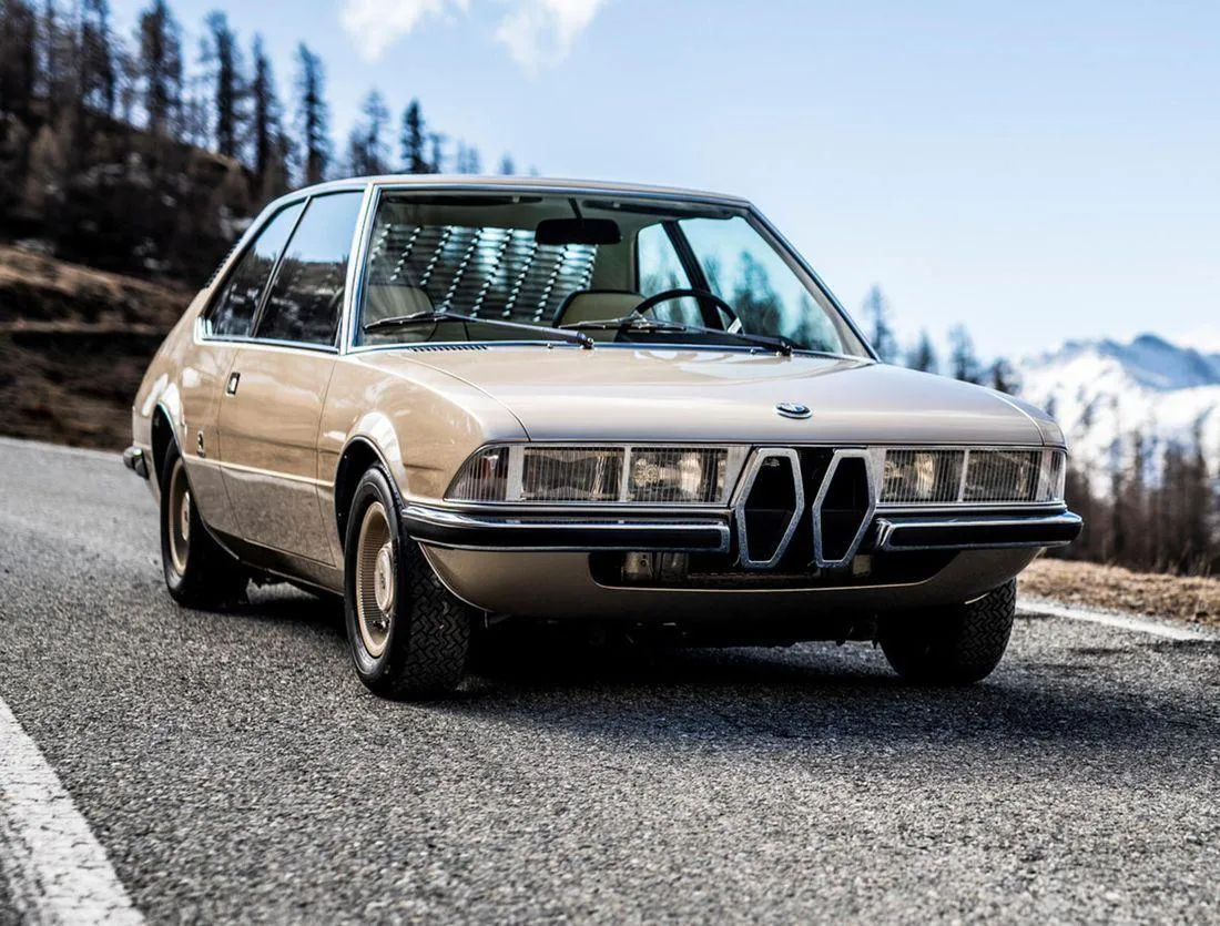 Bmw Vintage Model on a Scenic Snowy Mountain Road Image
