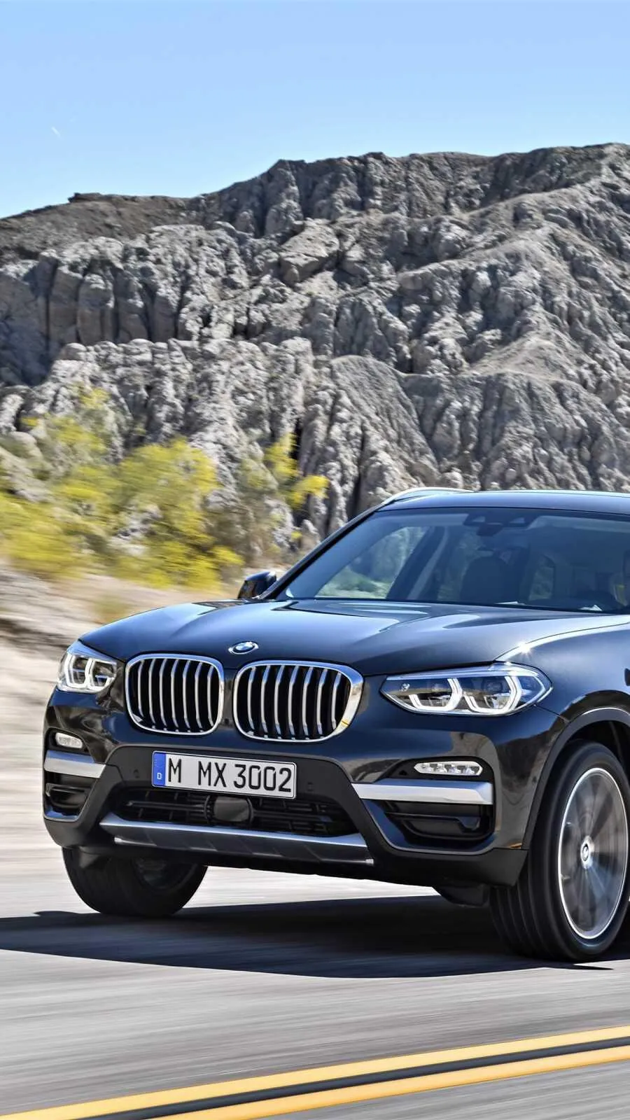 Bmw X3 Driving Along a Scenic and Curvy Mountain Road
