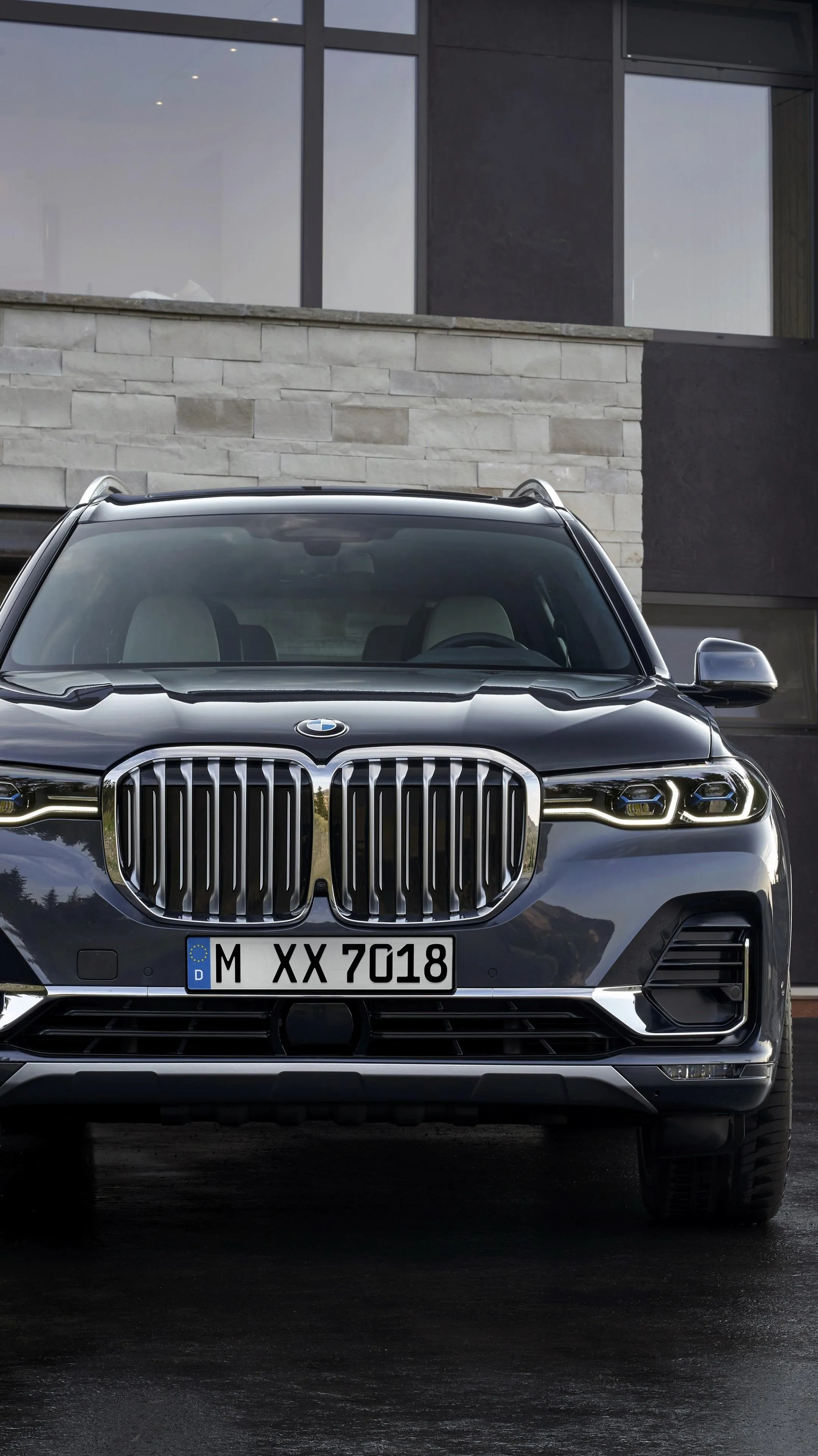 Bold Bmw Suv Parked Outside Modern Building in Daylight