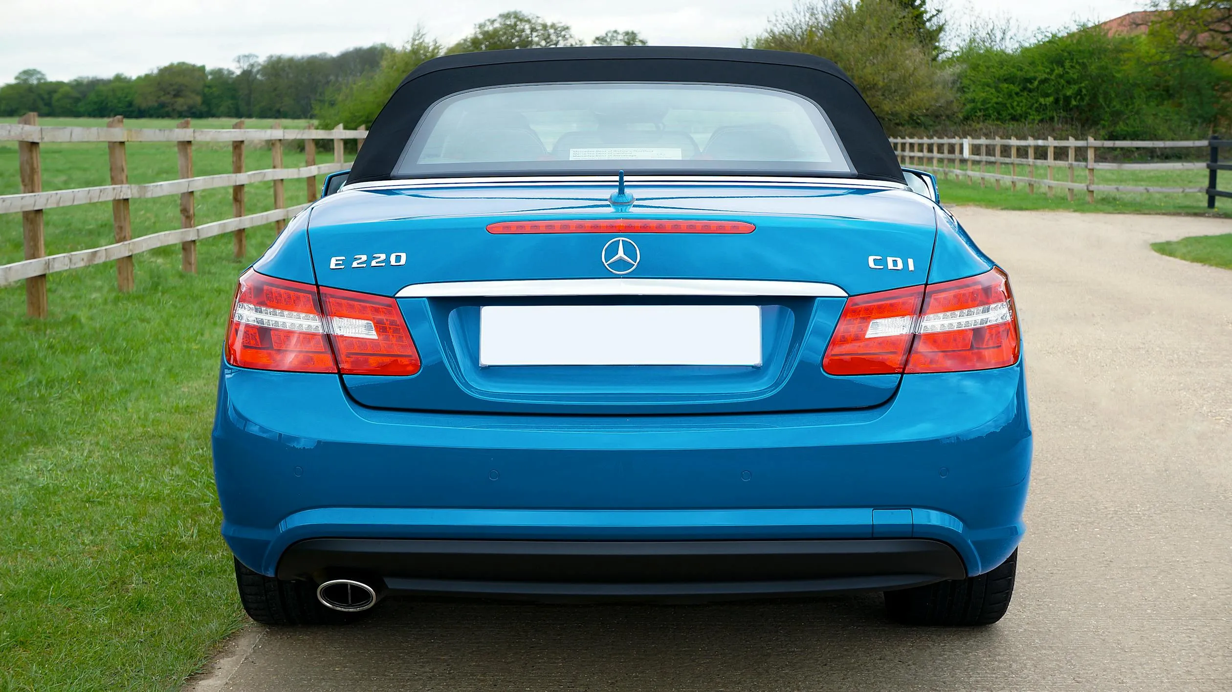 Bright Blue Mercedes Convertible On Country Road image