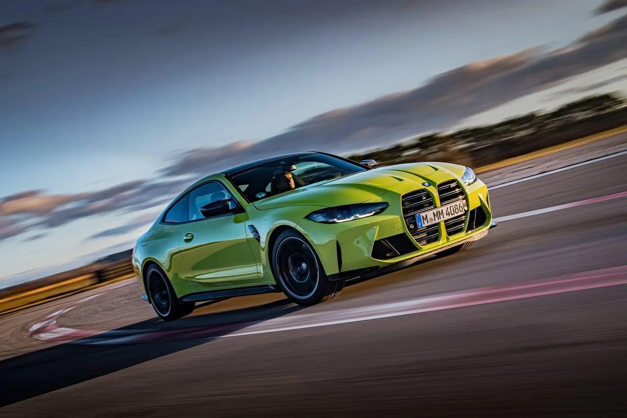 Bright Green Bmw Car Speeding Around Track Corner Image