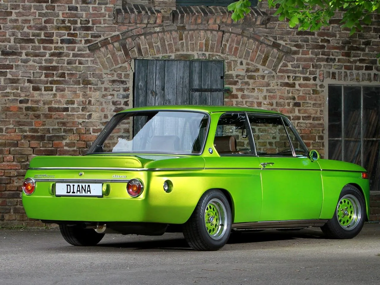 Bright Green Classic Bmw Model Parked on an Urban Street