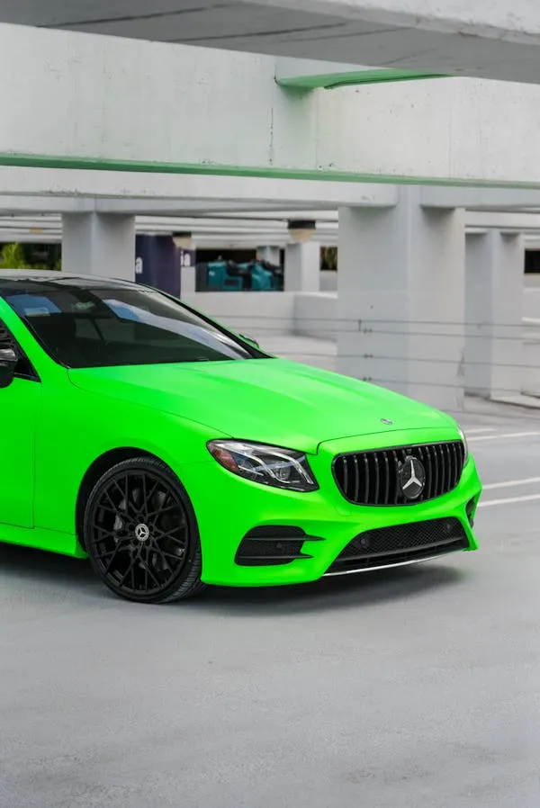 Bright Green Mercedes AMG in Parking Structure Wallpaper