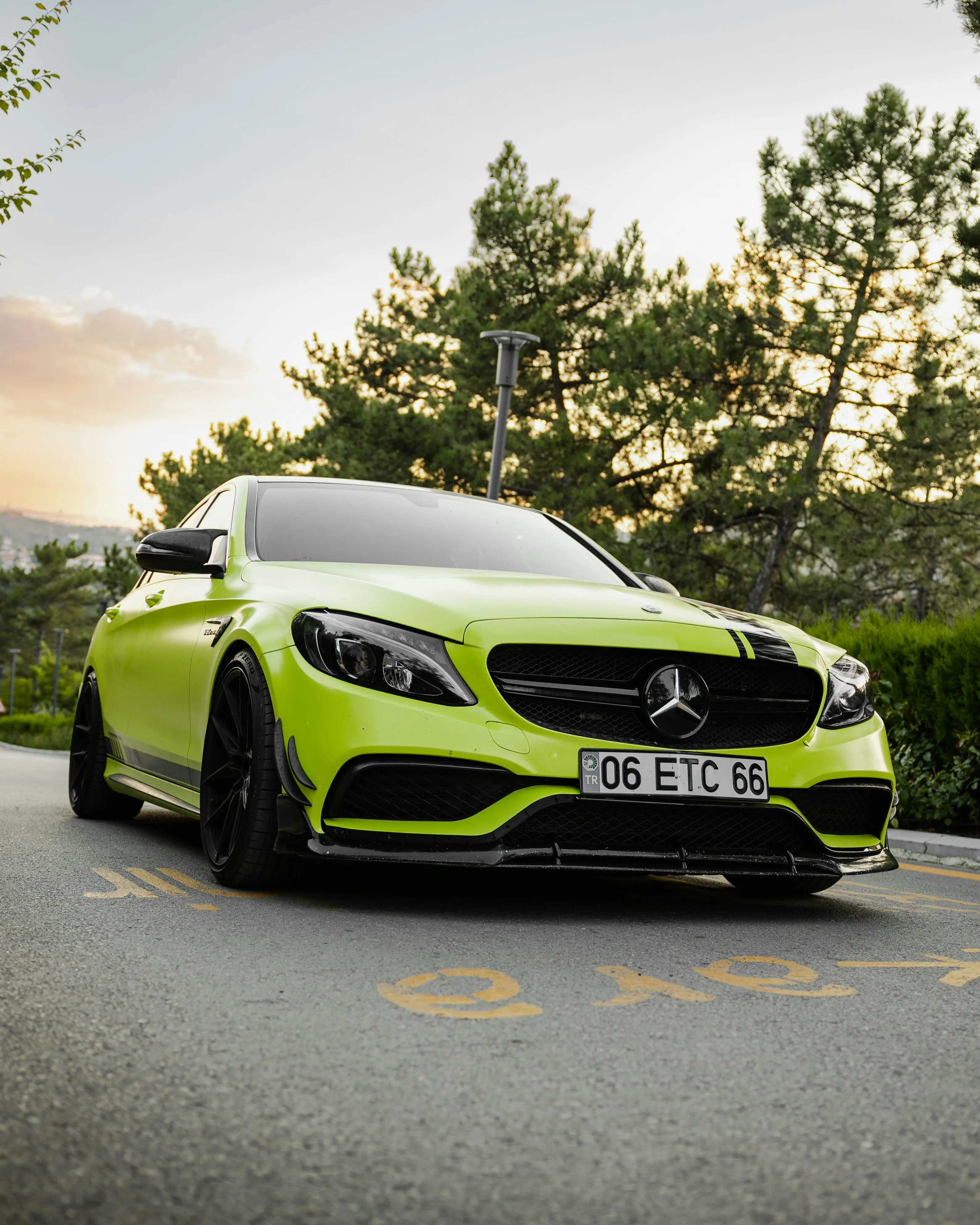 Bright Green Mercedes Benz Car Parked Outdoors image