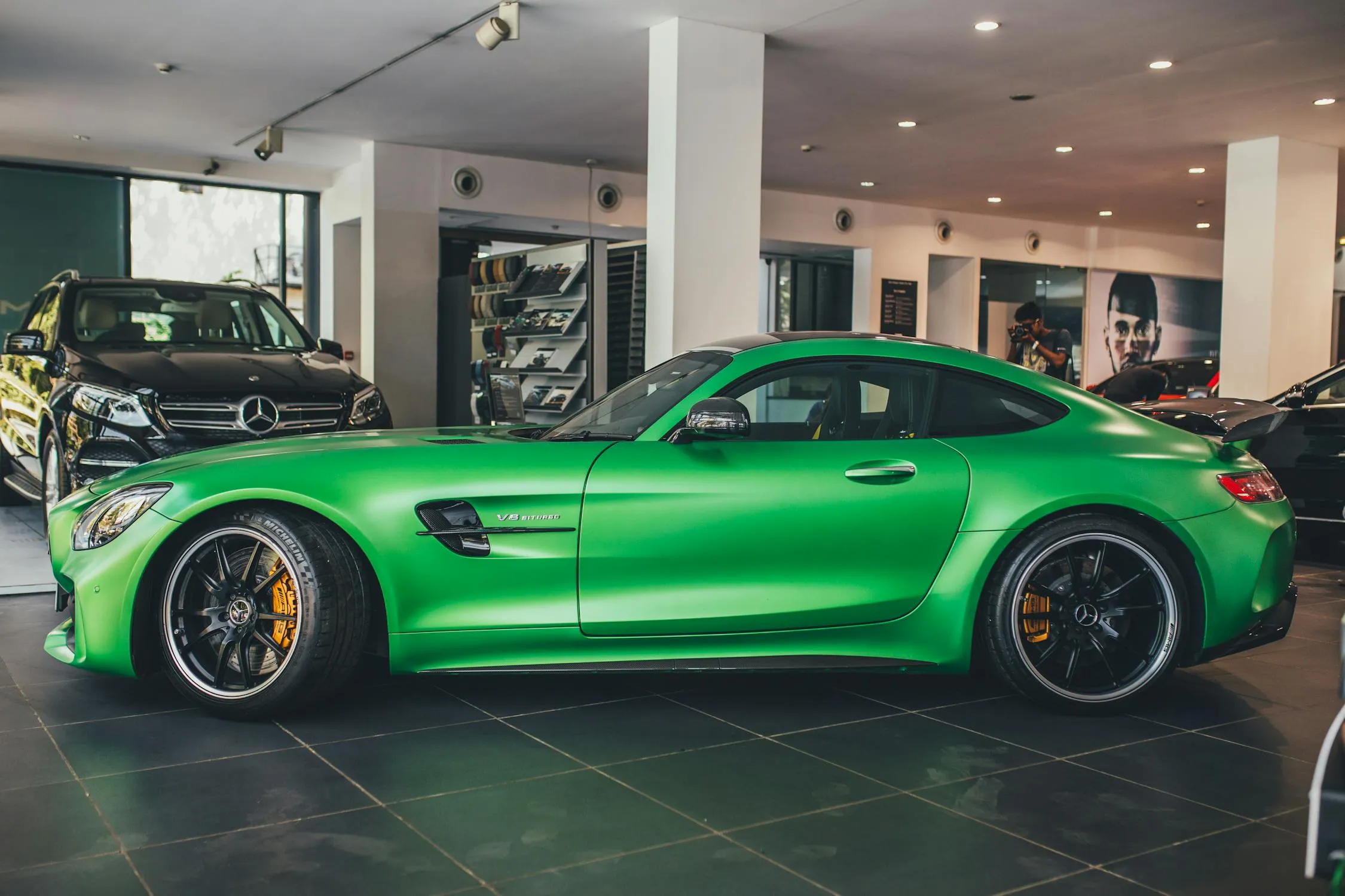 Bright Green Mercedes Benz Sports Car Inside Luxury Showroom