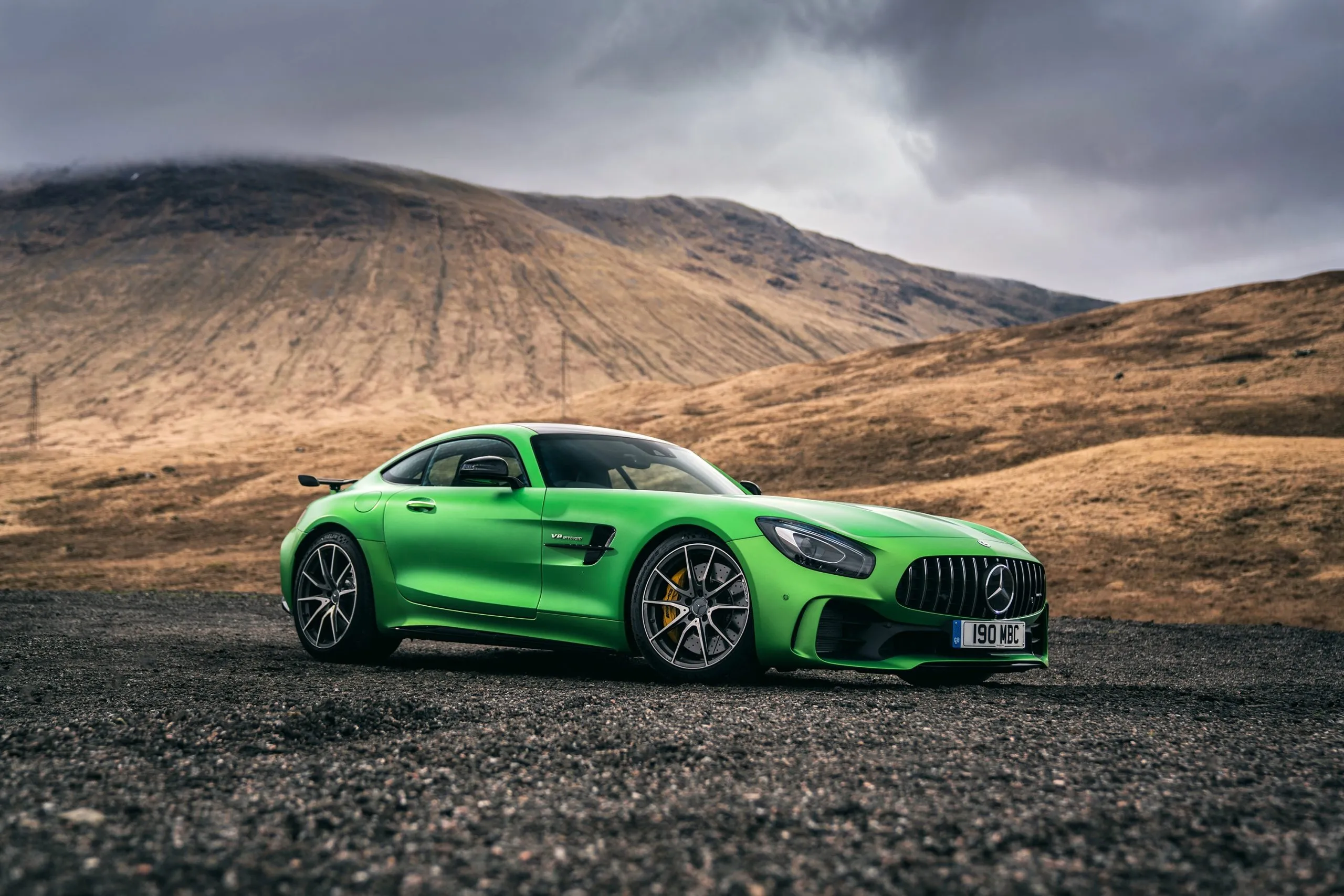 Bright Green Mercedes Benz Sports Car Parked in Desert