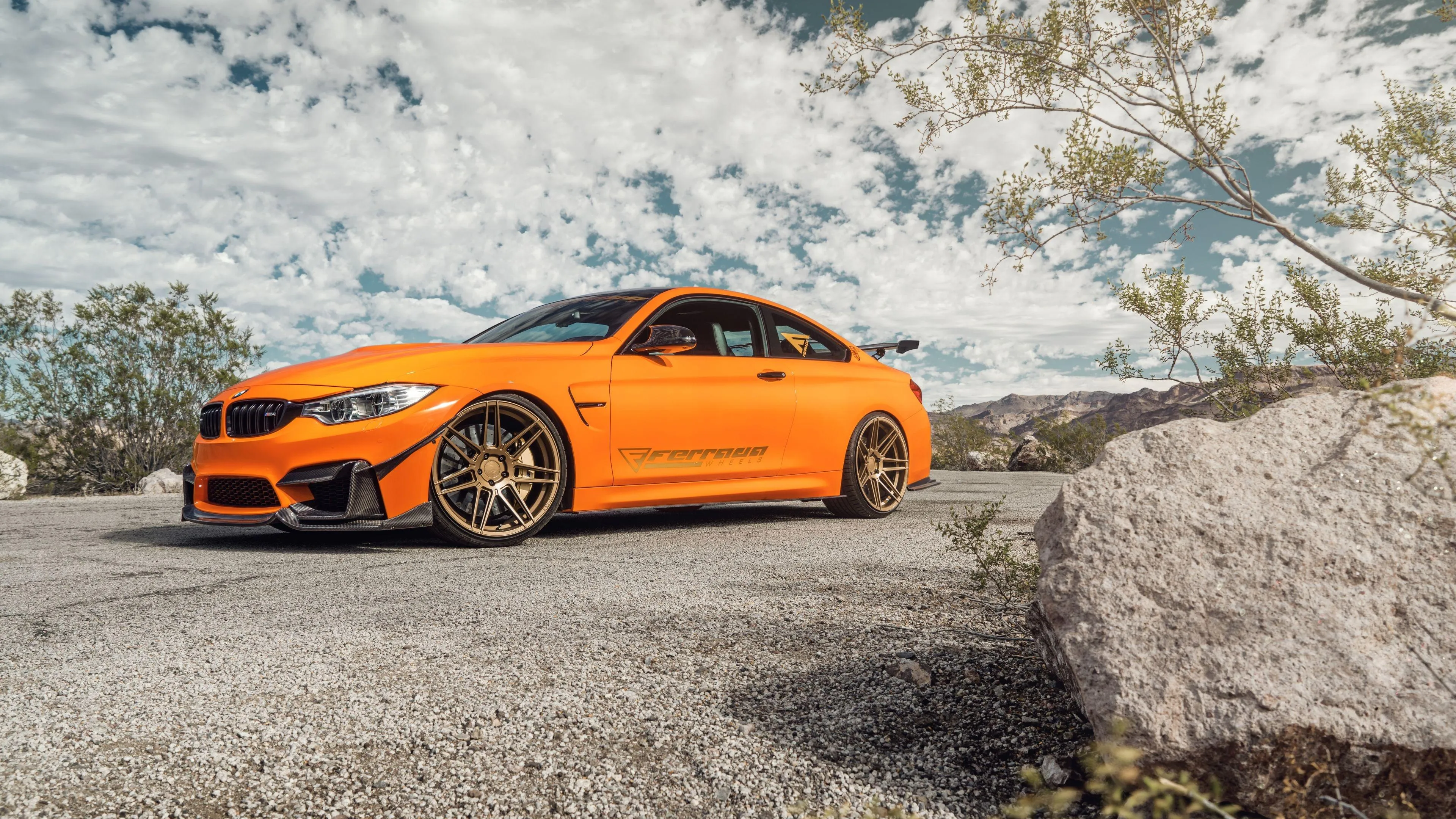 Bright Orange Bmw Coupe Parked on Mountain Roadside