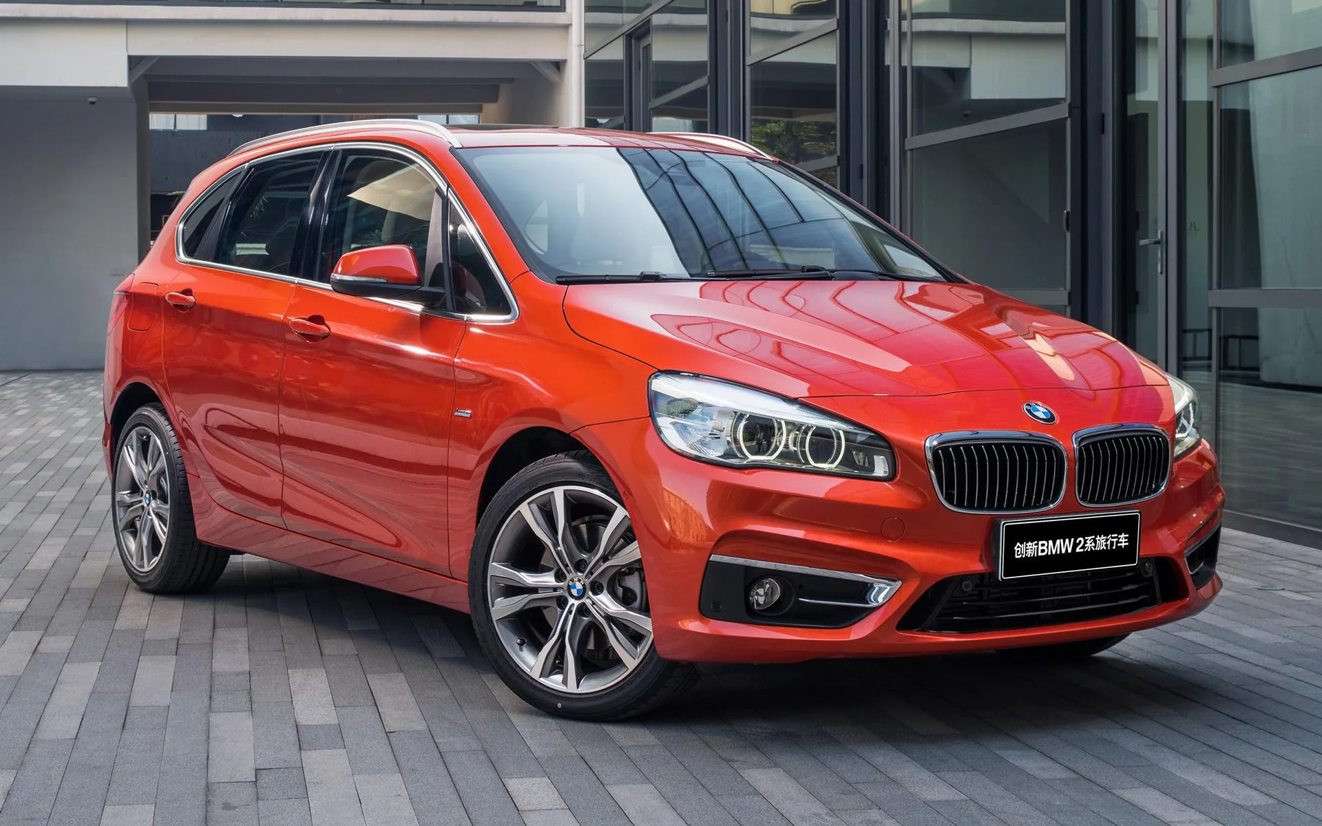 Bright Red Bmw Compact Car Parked in Urban City Street